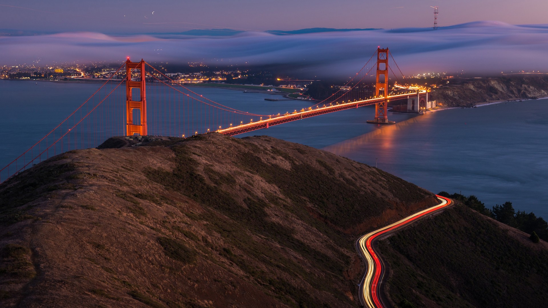 Golden Gate Bridge at night with fog and light trails HD Wallpaper