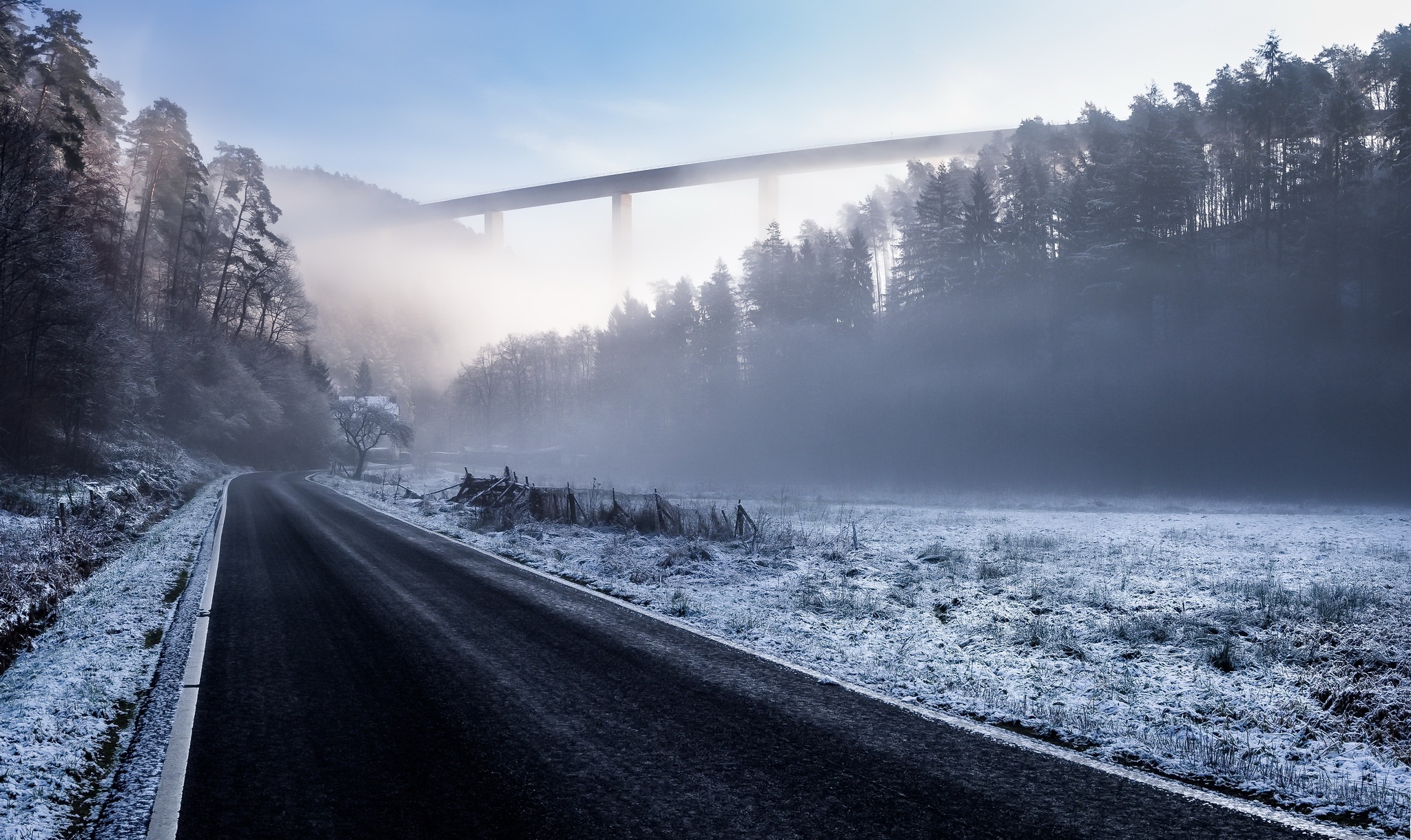 Winter road through misty forest with bridge HD Wallpaper
