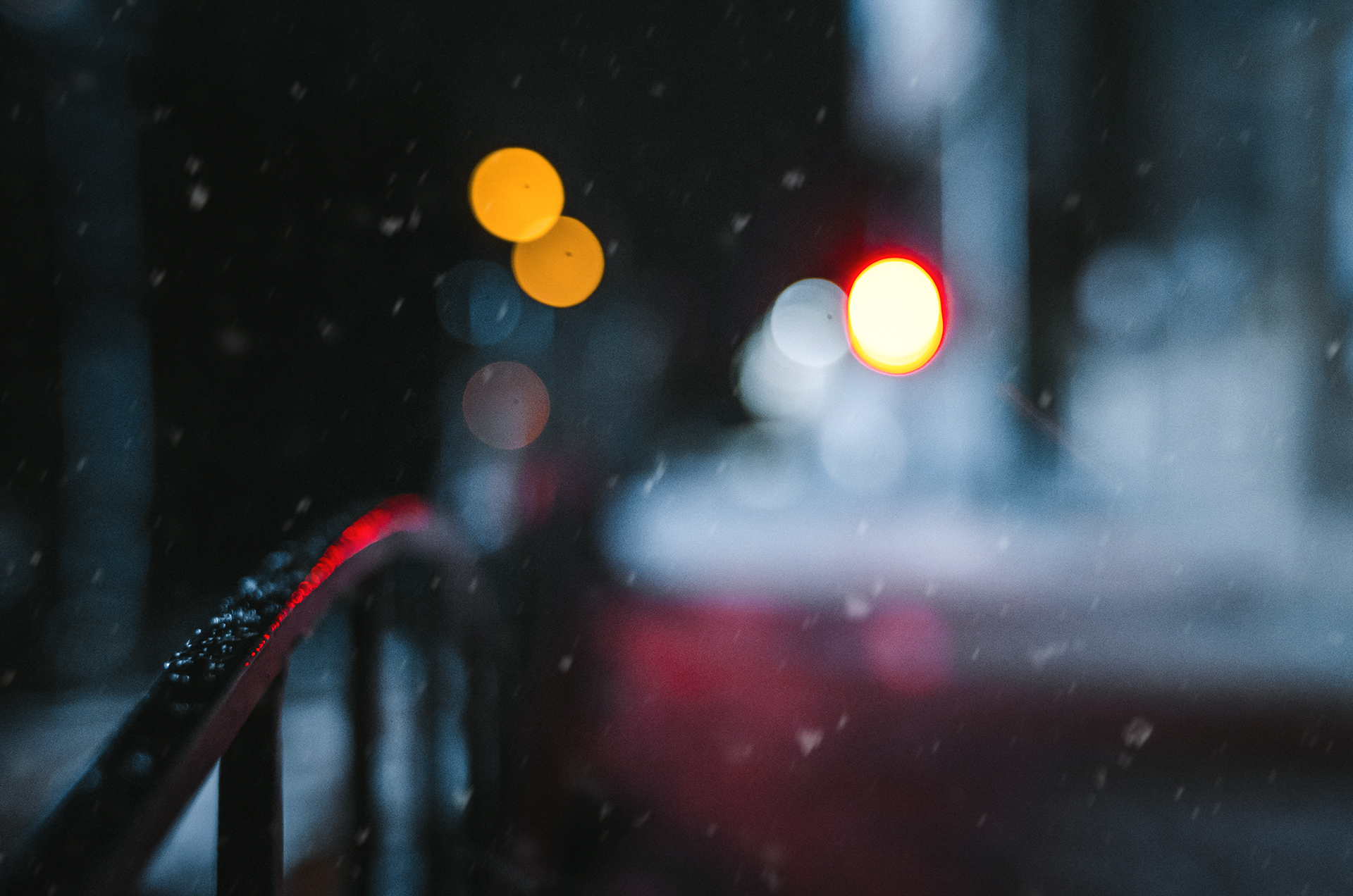 Night cityscape with bokeh lights and snow HD Wallpaper