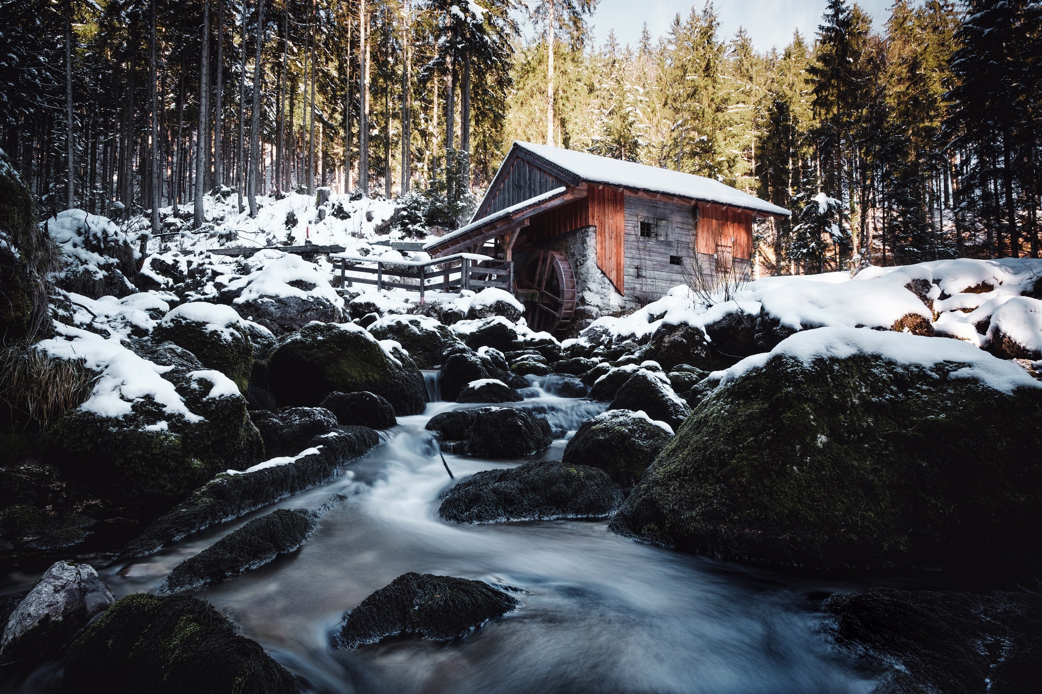 Wooden mill by a stream in a snowy forest HD Wallpaper