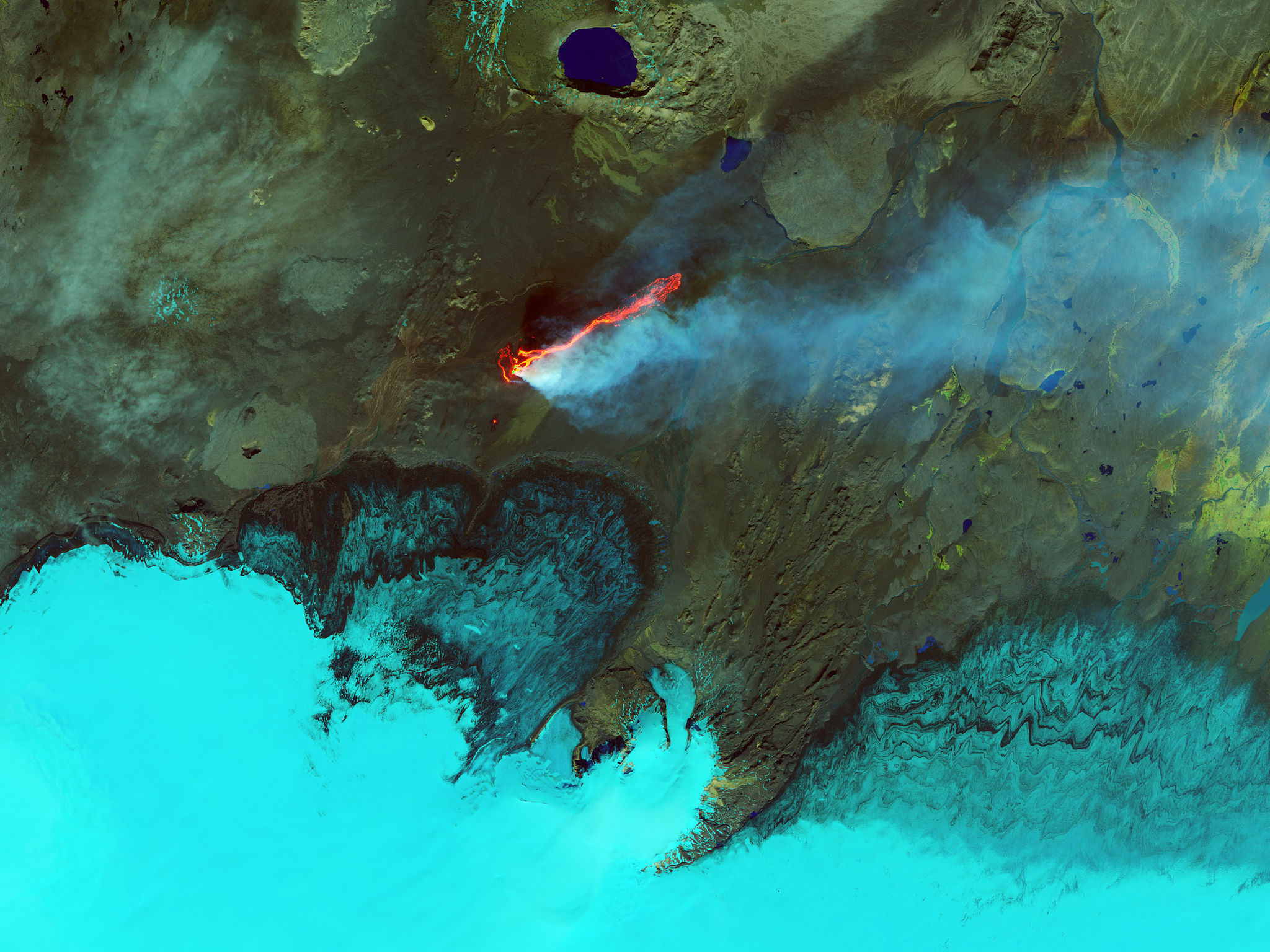 Aerial view of volcanic eruption in Iceland with lava and smoke HD Wallpaper
