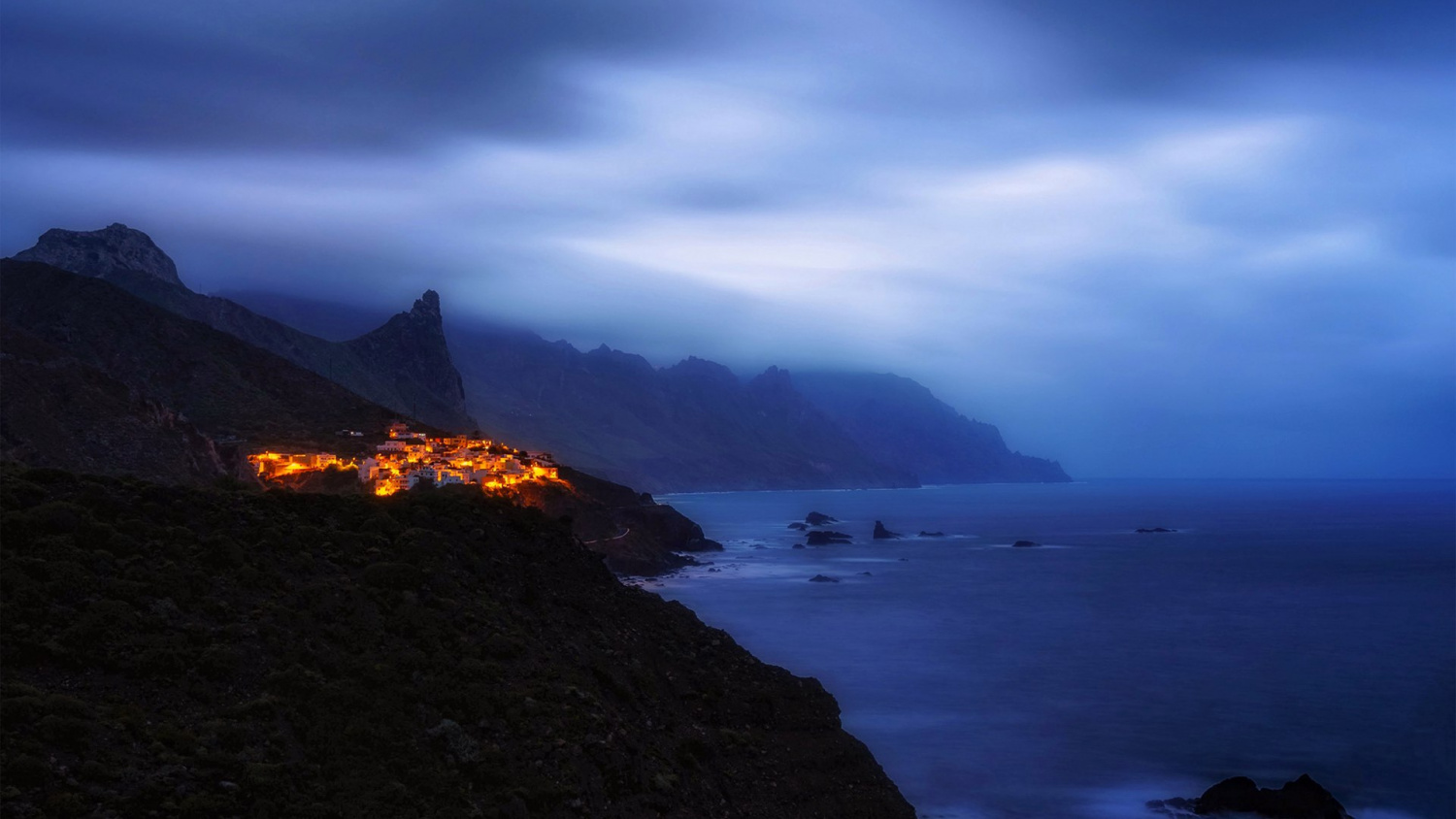 Village lights on a misty coast at dusk, Tenerife HD Wallpaper