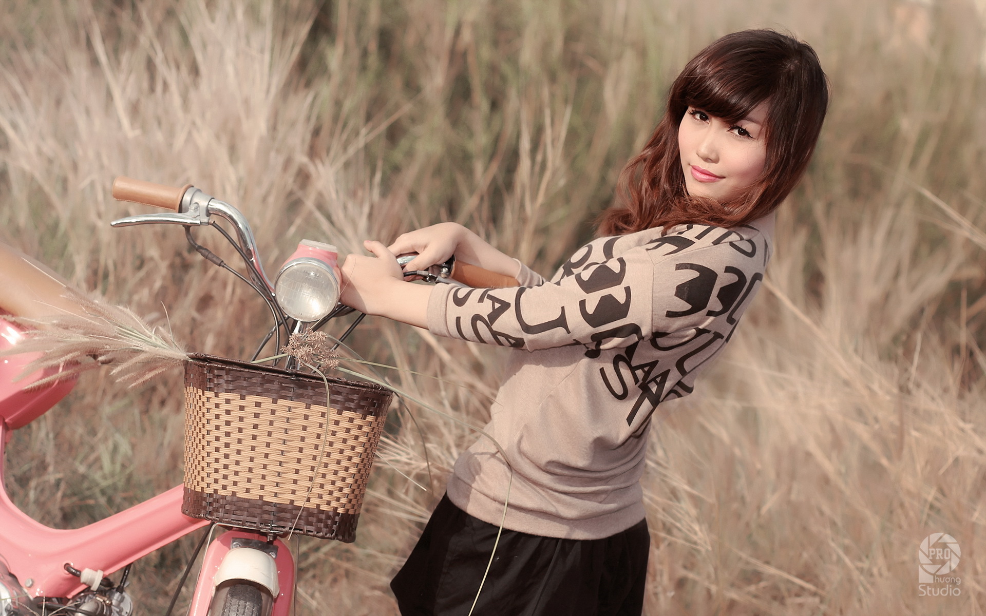 Asian woman with bicycle in tall grass HD Wallpaper