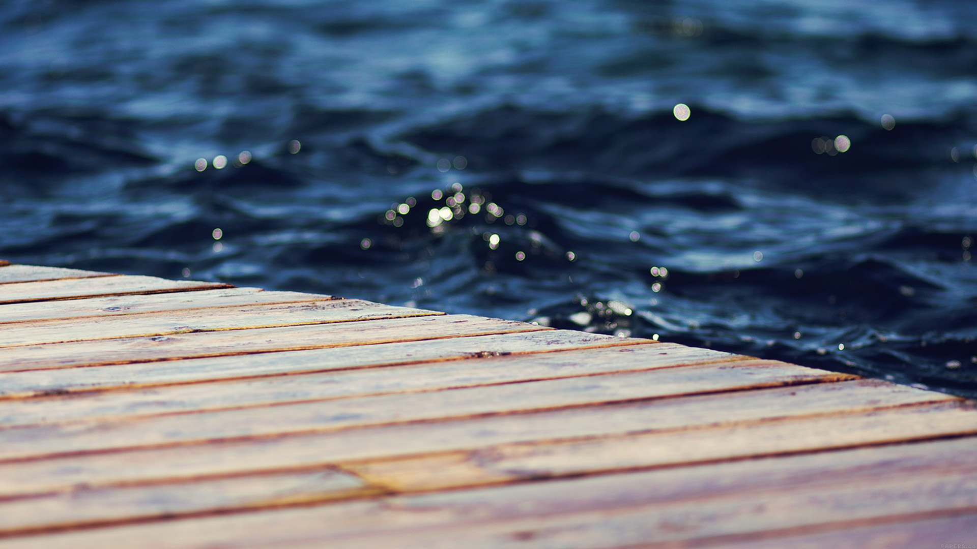 Wooden pier by the blue water HD Wallpaper