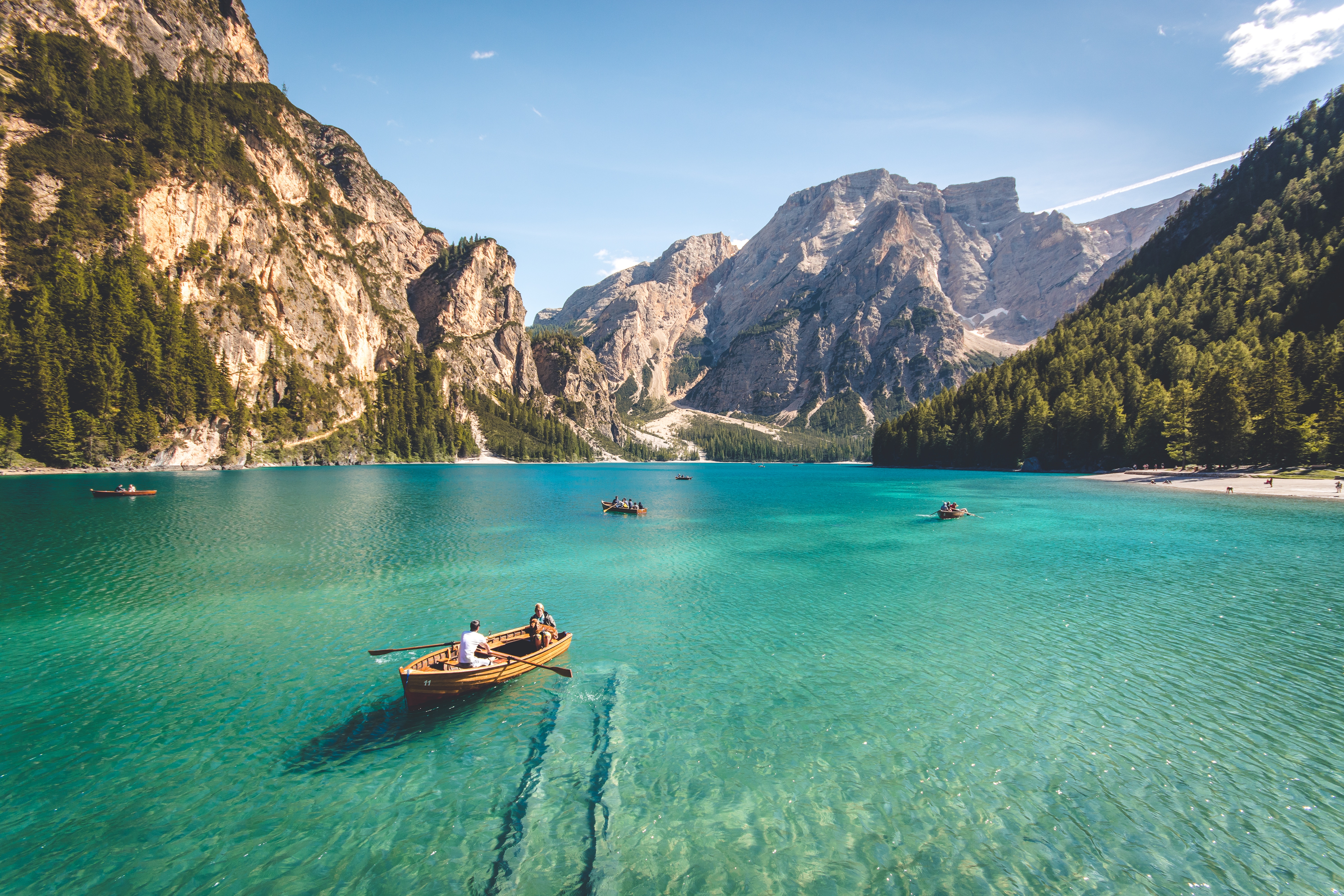 Boats on a clear lake with mountains and trees HD Wallpaper