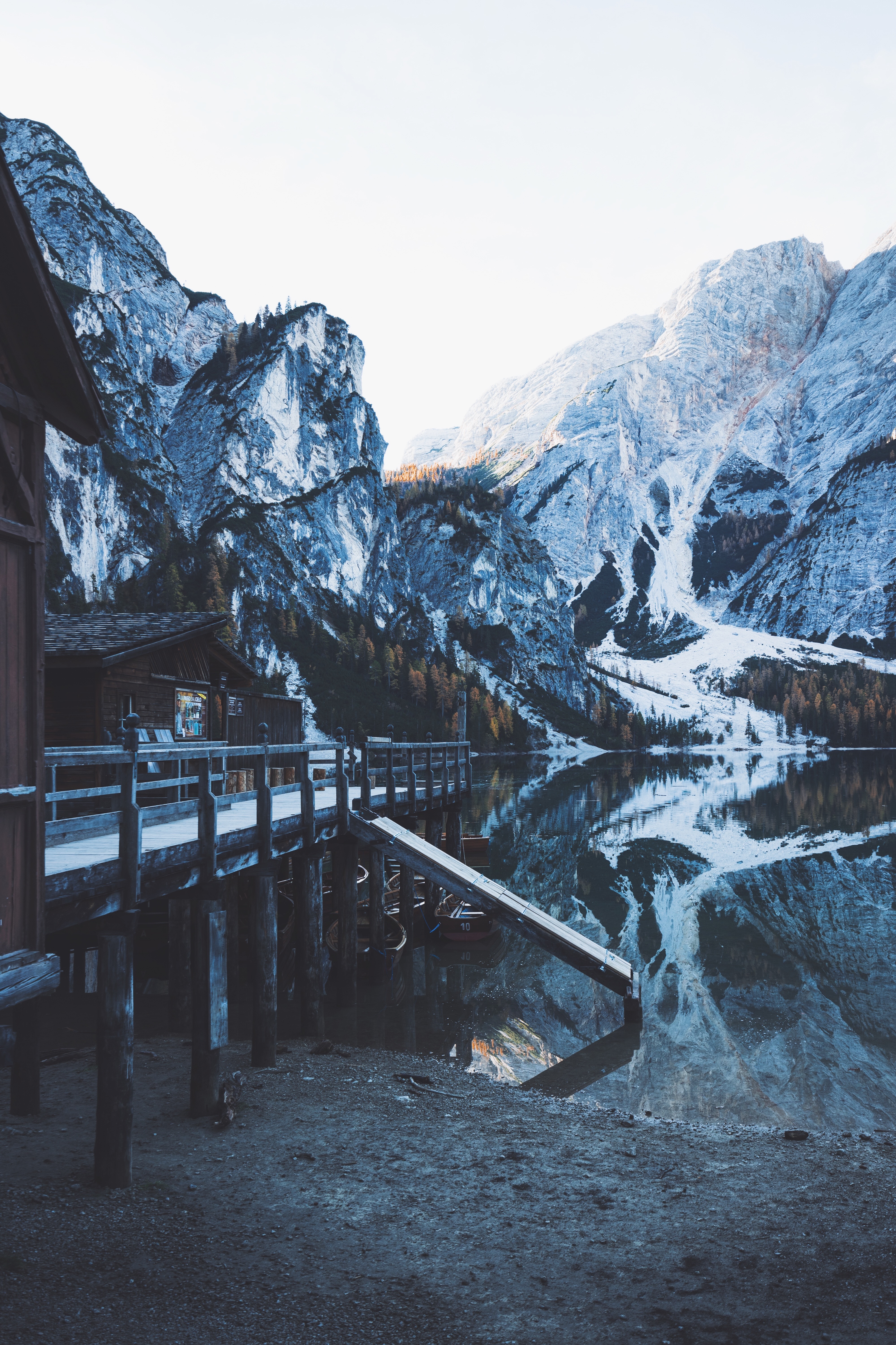 Wooden pier and boathouse on a mountain lake HD Wallpaper