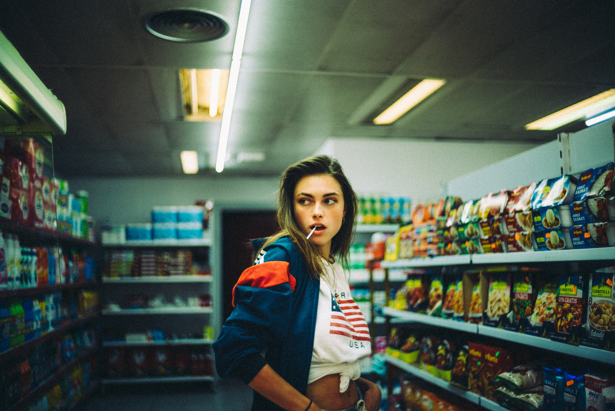 Woman with lollipop in a convenience store HD Wallpaper