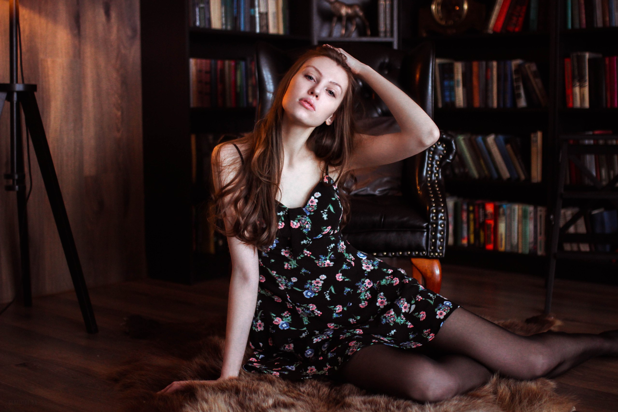 Woman with long hair sitting on the floor HD Wallpaper