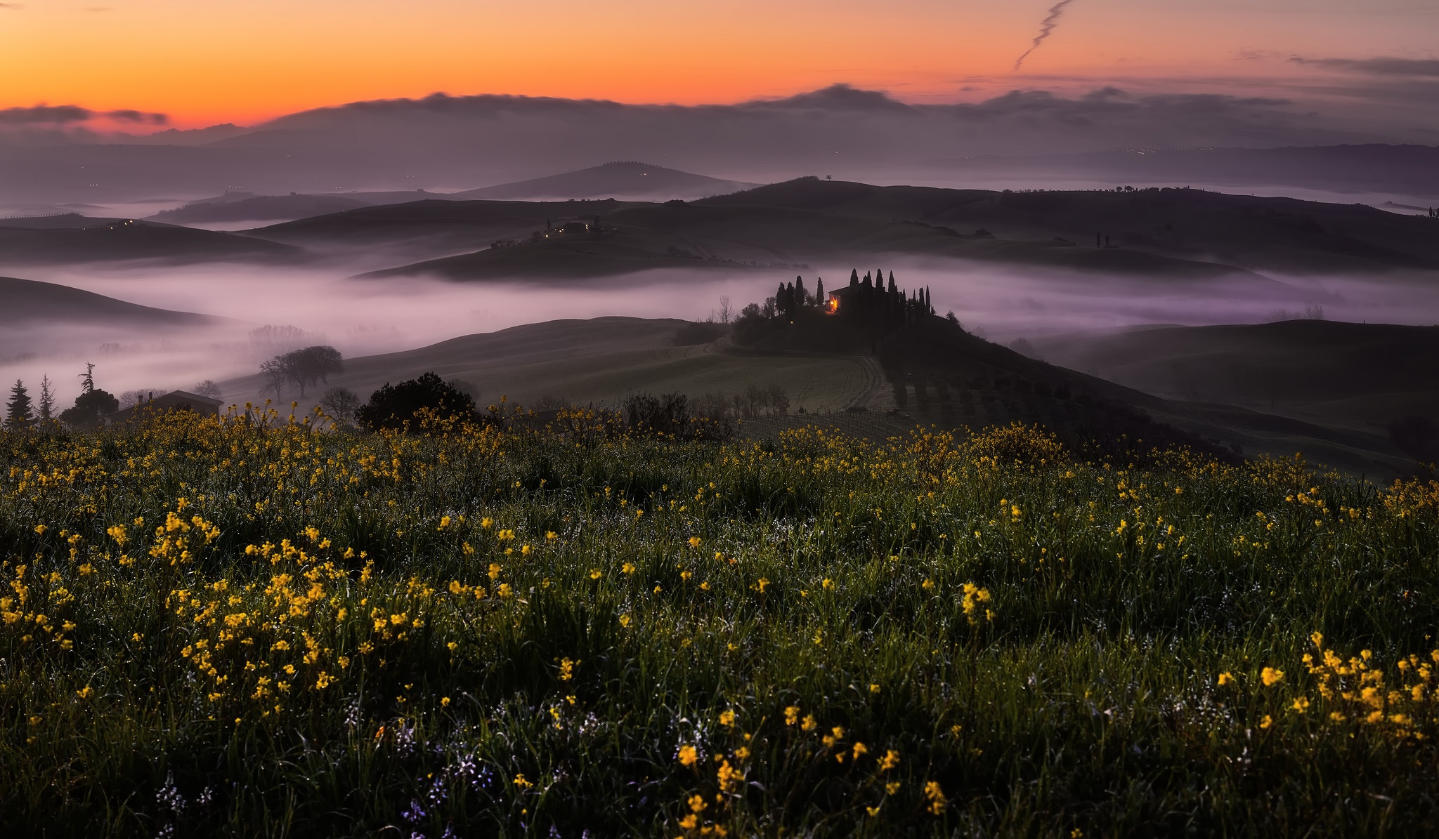 Tuscan landscape with rolling hills and fog at sunrise HD Wallpaper