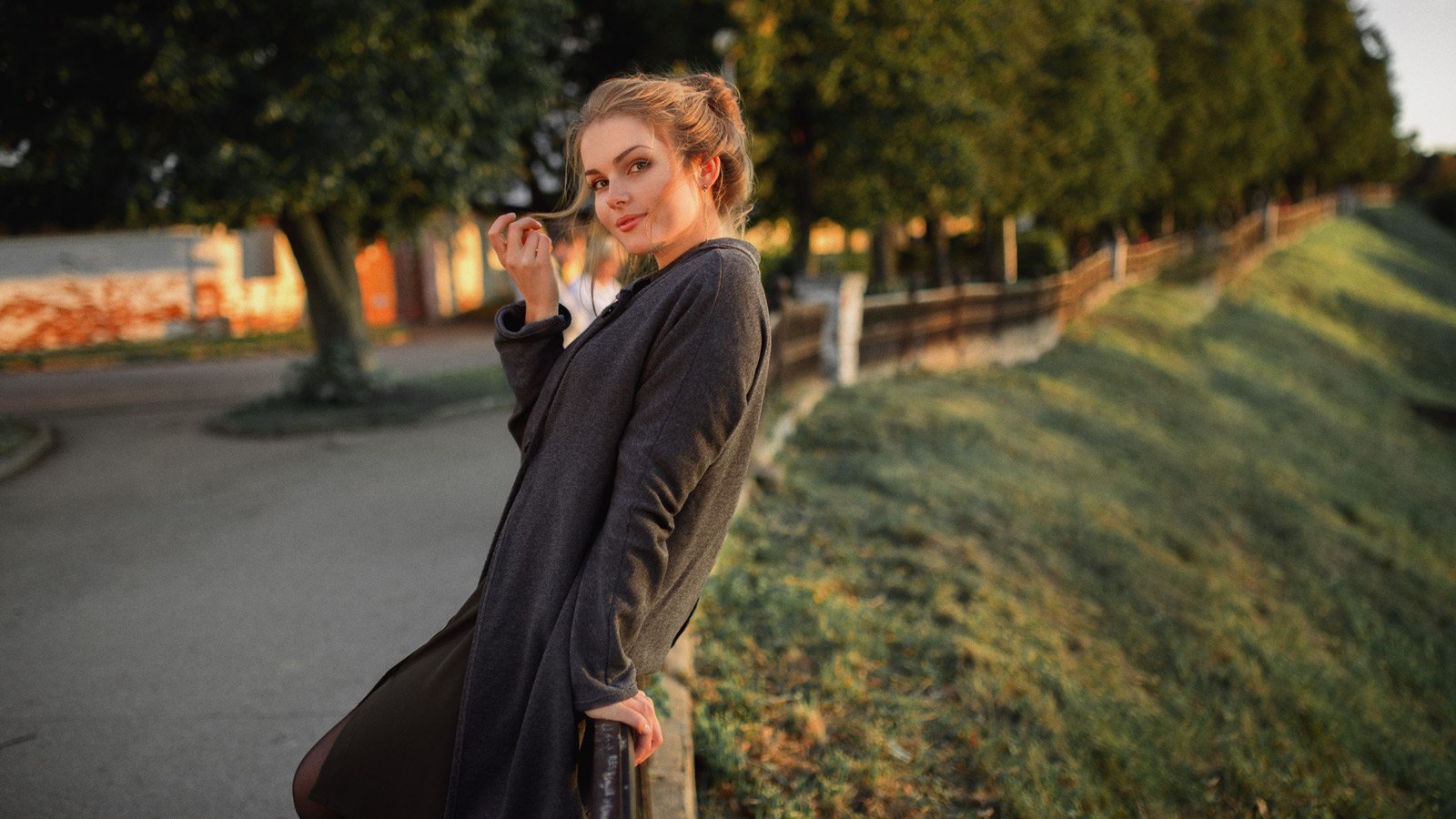 Woman in grey coat outdoors HD Wallpaper