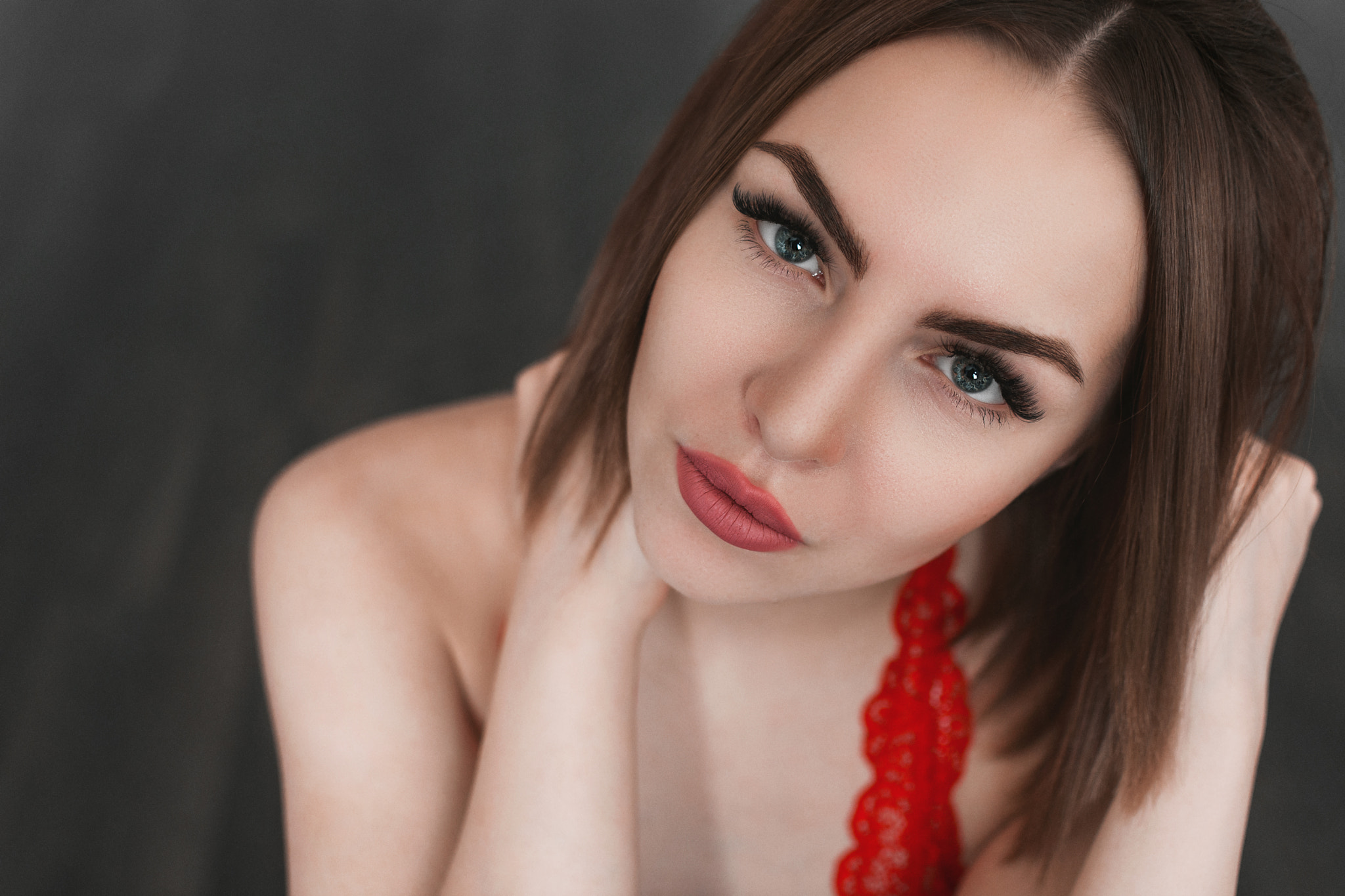 Woman with red lace top and dark background HD Wallpaper