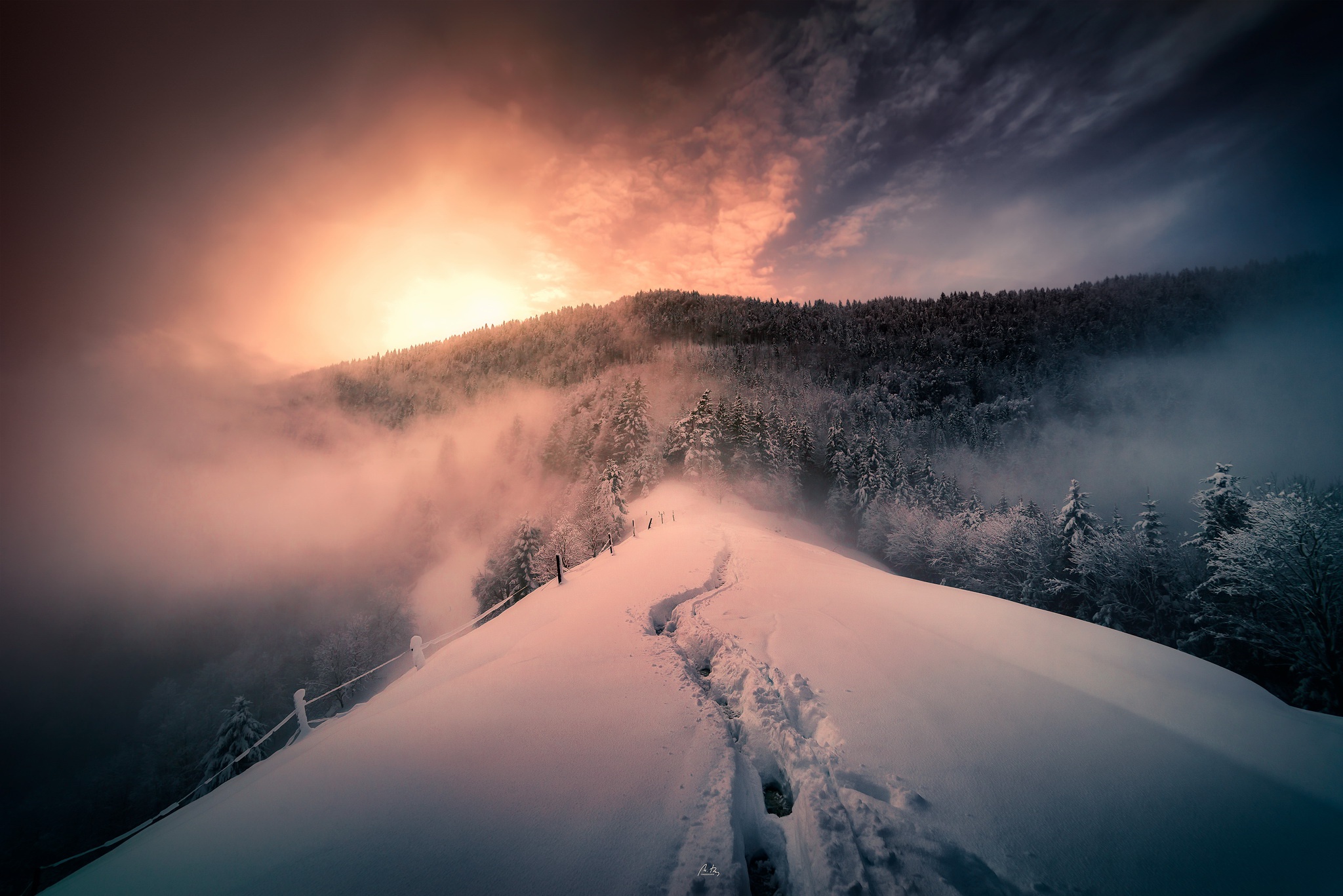 Snowy mountain path with sunrise and fog HD Wallpaper