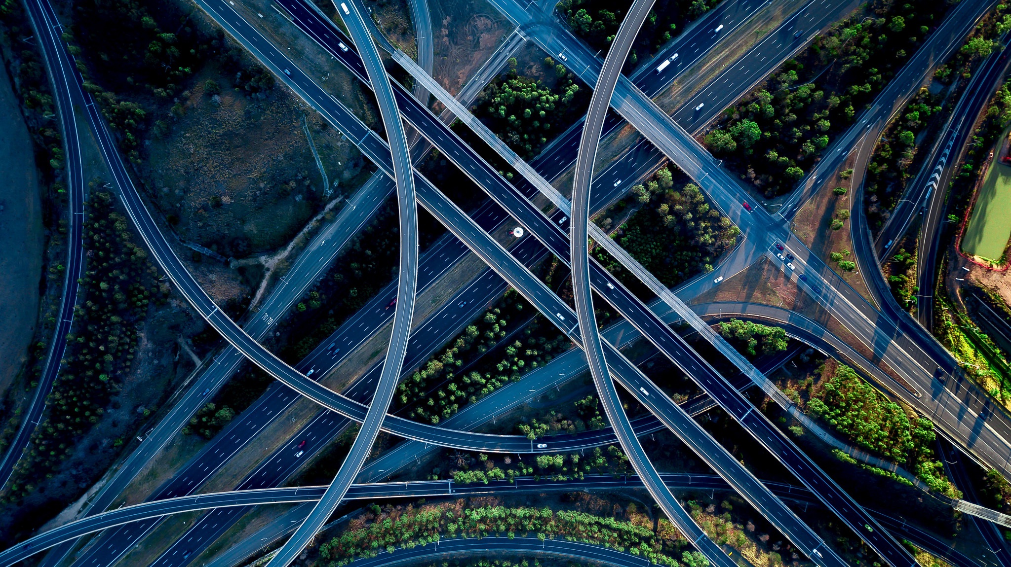 Aerial view of a complex highway interchange HD Wallpaper