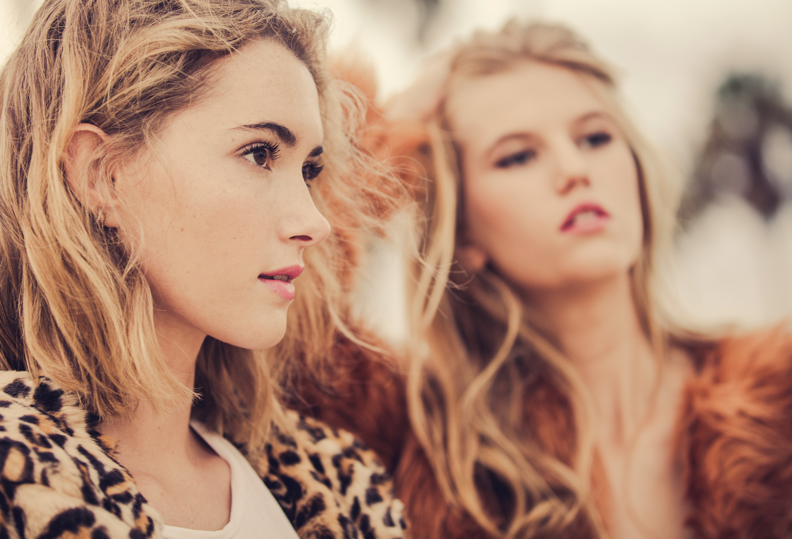 Two blonde women in fur coats HD Wallpaper
