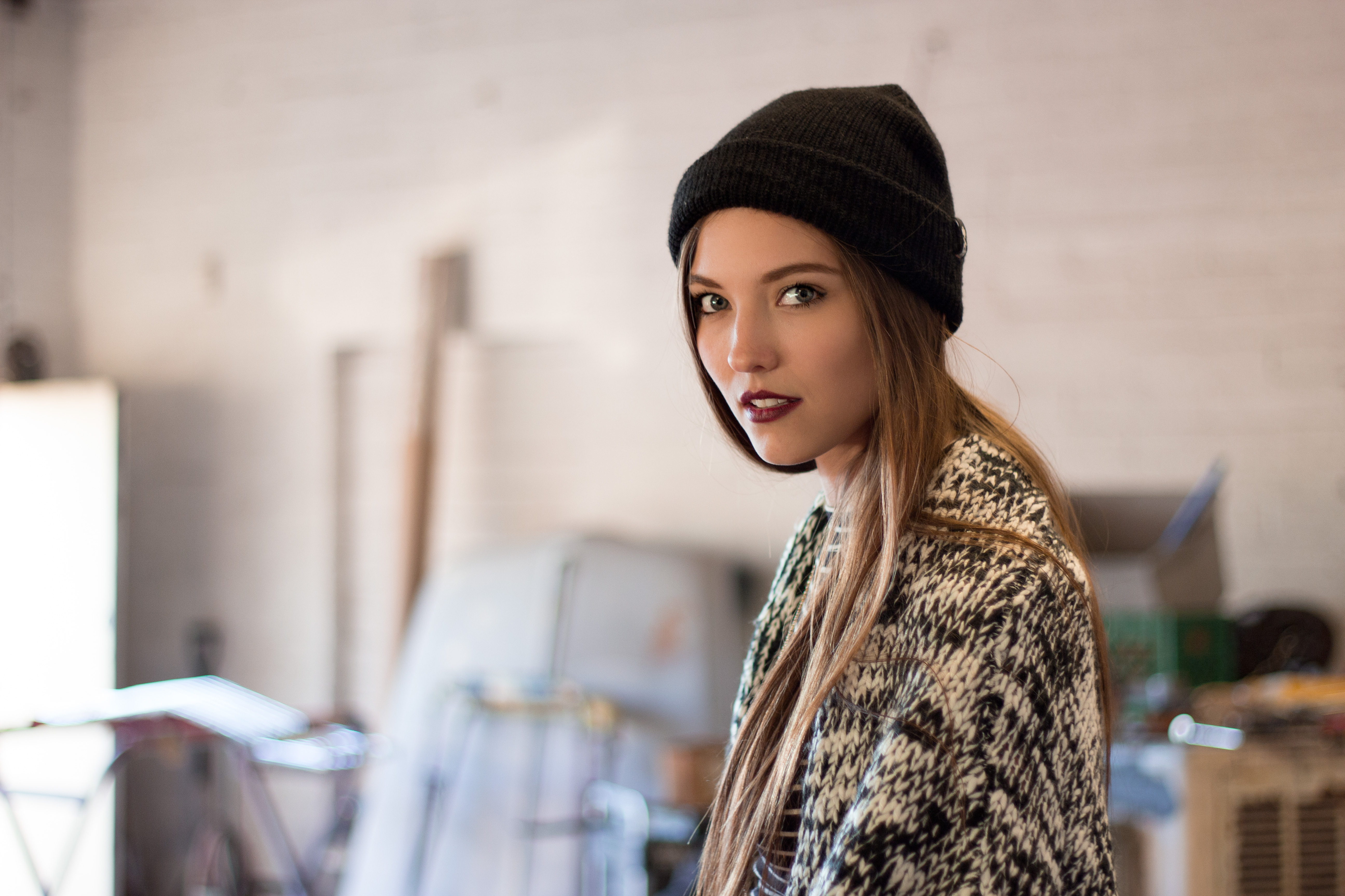 Savvy Taylor wearing a black beanie and patterned sweater HD Wallpaper