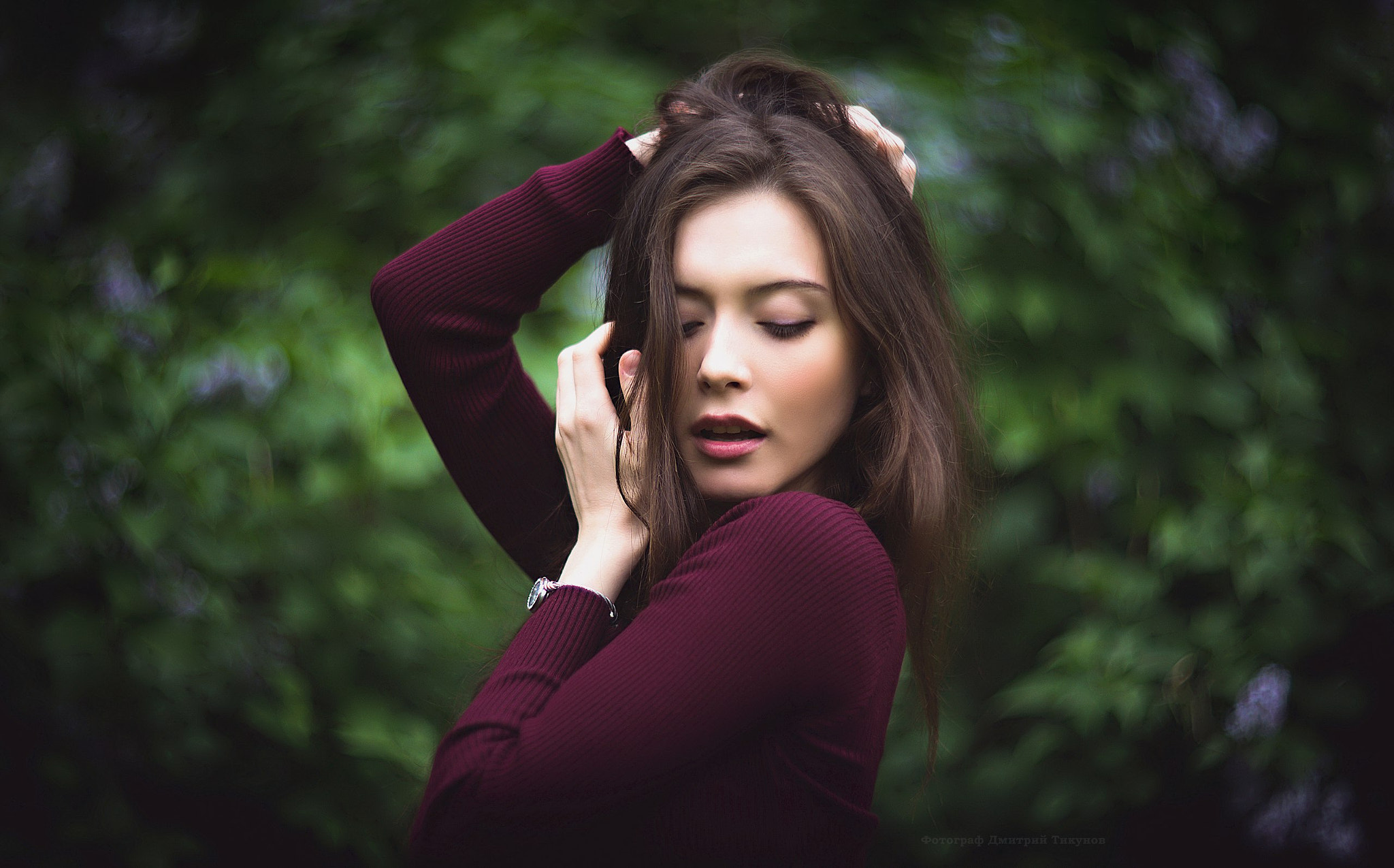 Portrait of a woman with hands in her hair HD Wallpaper