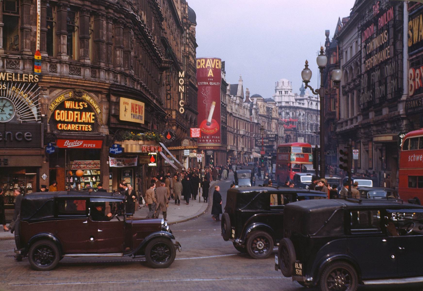Vintage London street with cars and advertisements HD Wallpaper