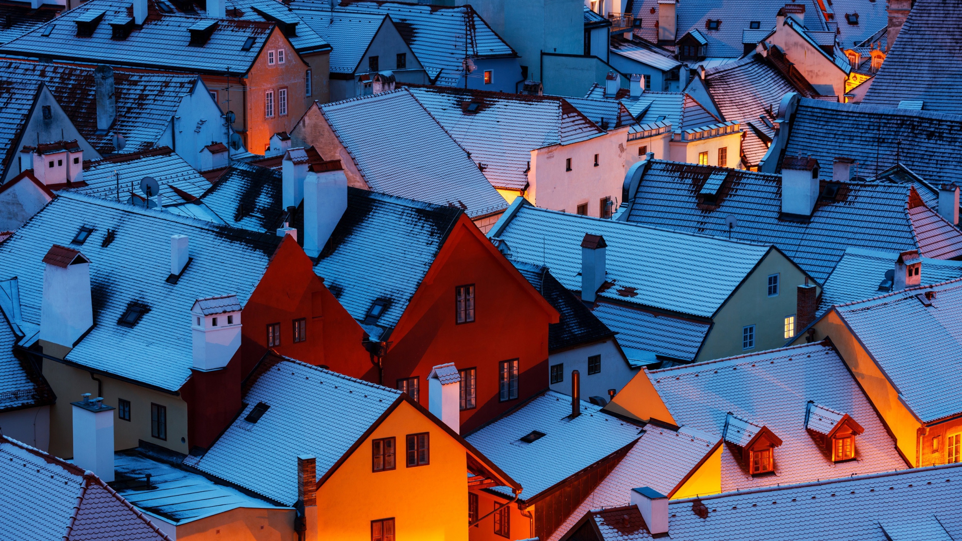 Rooftops of a village in the Czech Republic covered in snow during the evening. HD Wallpaper