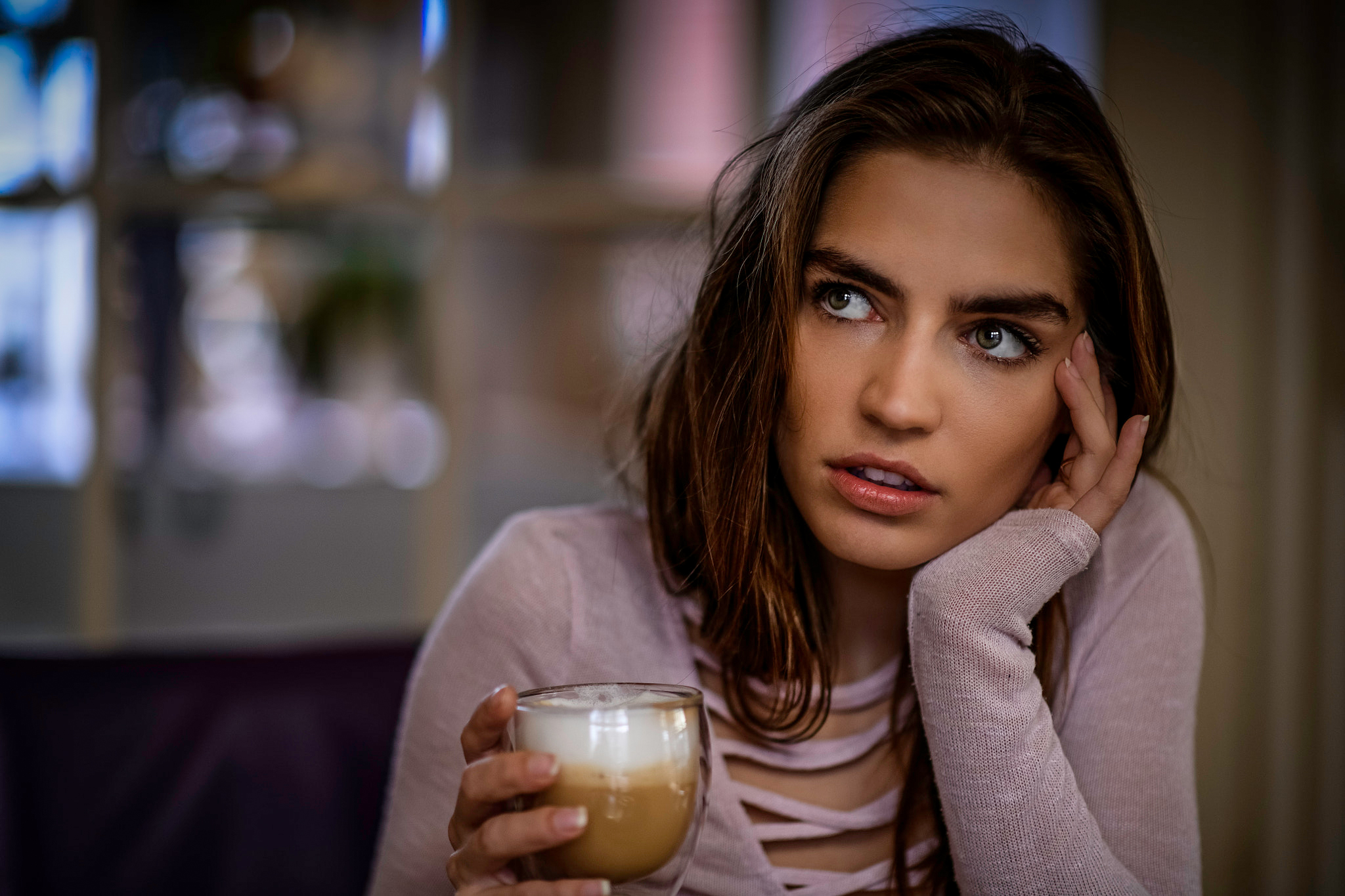 Woman holding a coffee cup, looking away HD Wallpaper
