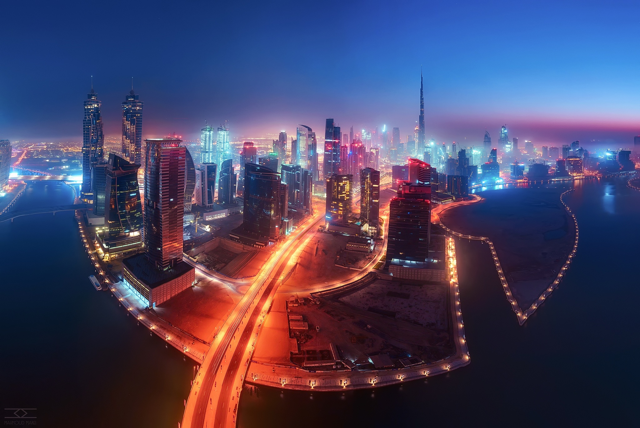 Dubai cityscape at night with illuminated skyscrapers HD Wallpaper