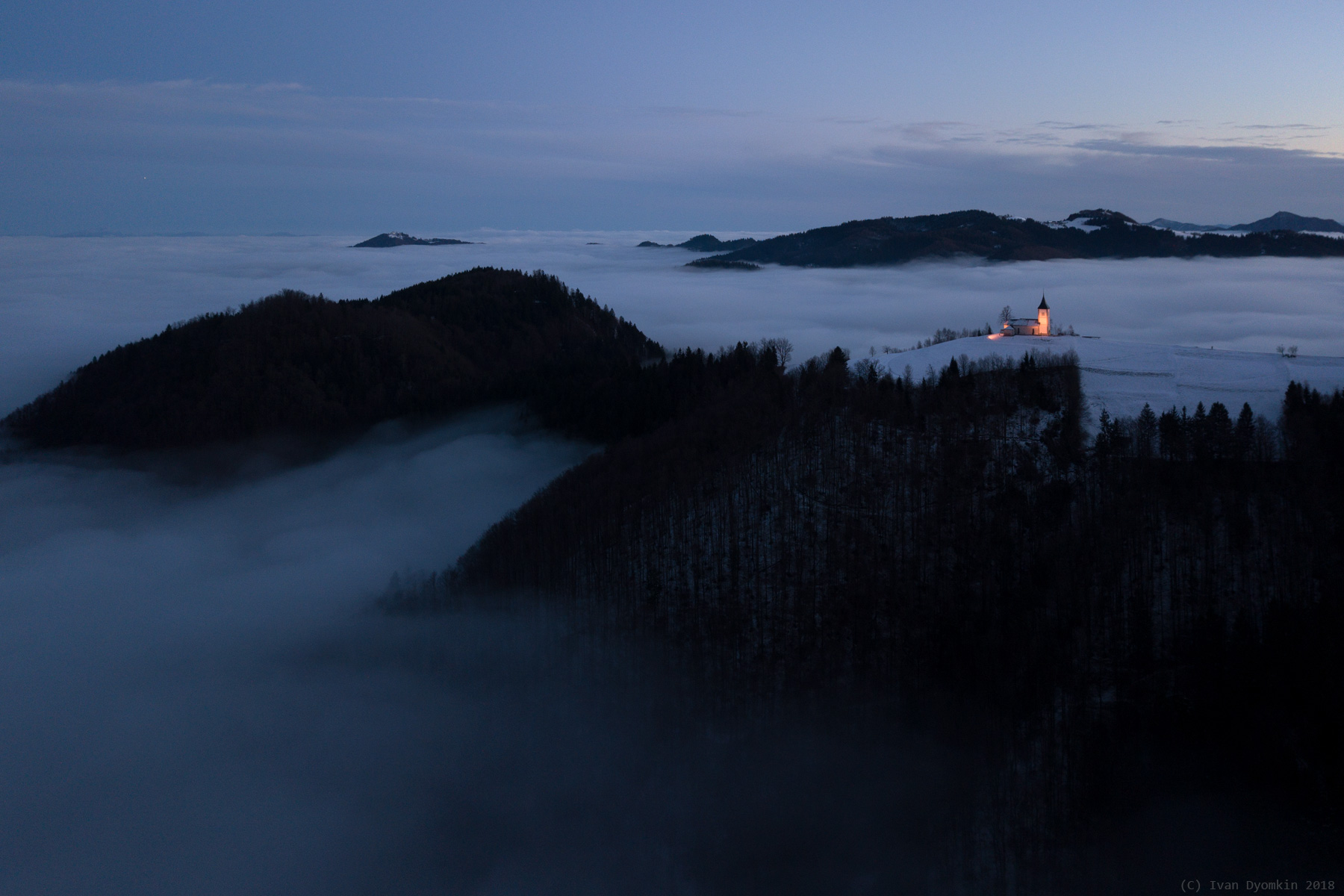 Church on a hill above fog at dusk HD Wallpaper