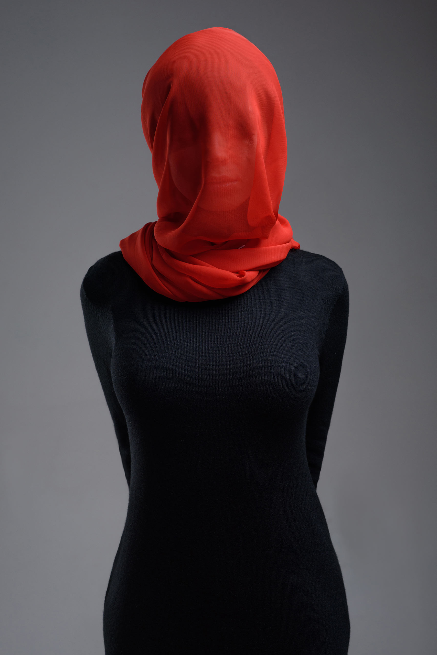 Woman in black dress with red see-through headscarf HD Wallpaper