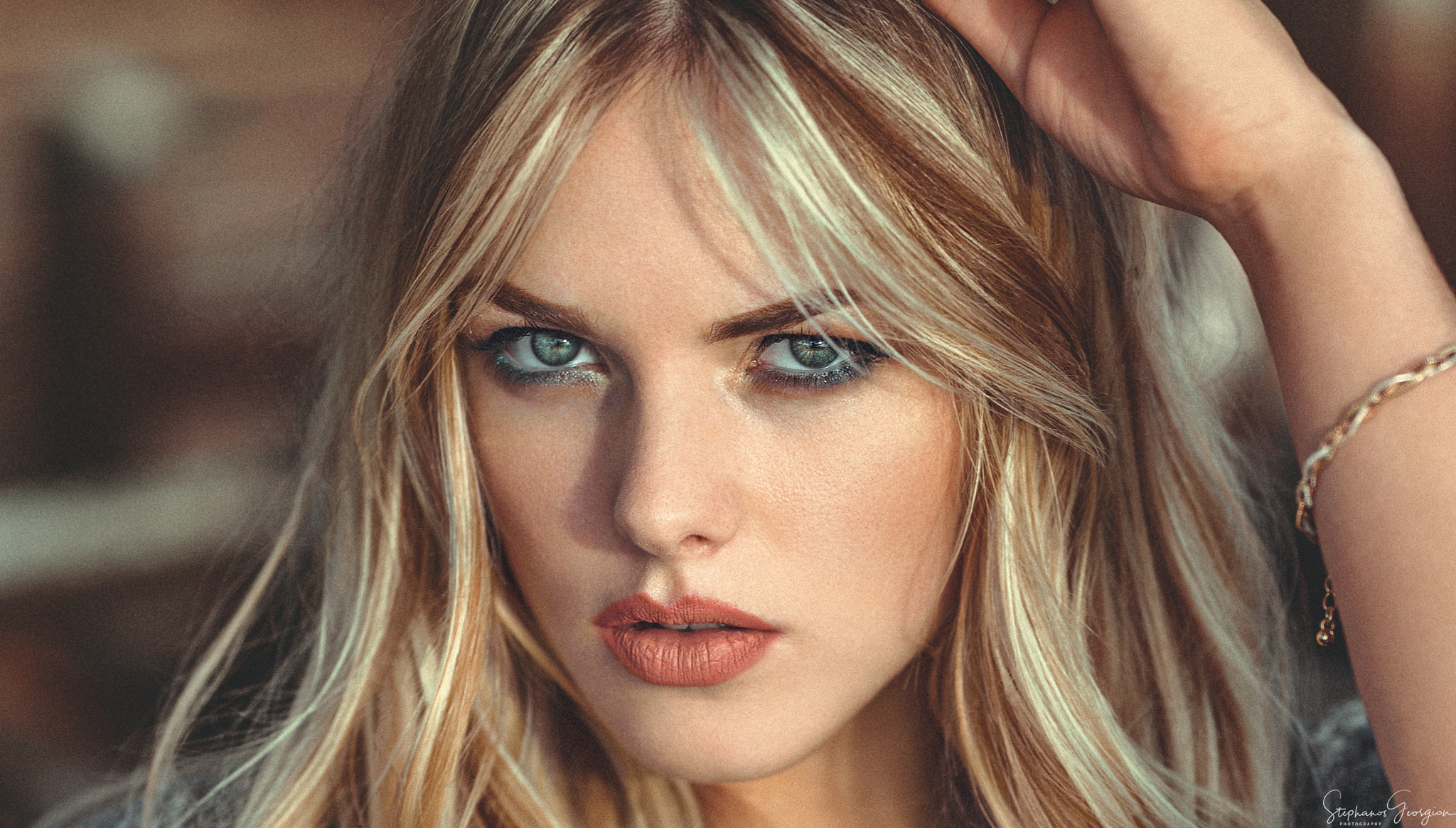 Portrait of a blonde woman with blue eyes HD Wallpaper