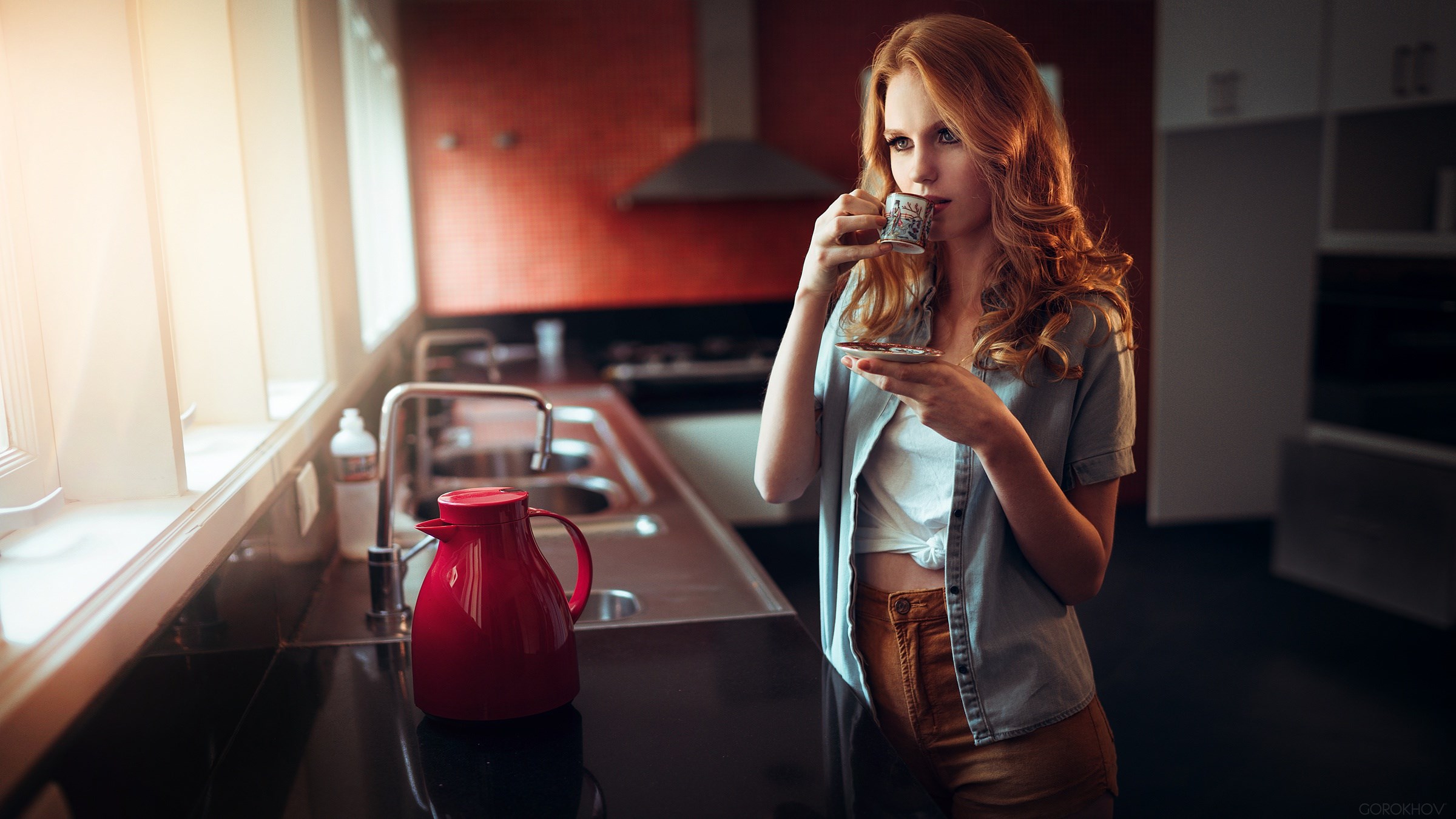 Woman drinking coffee in a kitchen HD Wallpaper