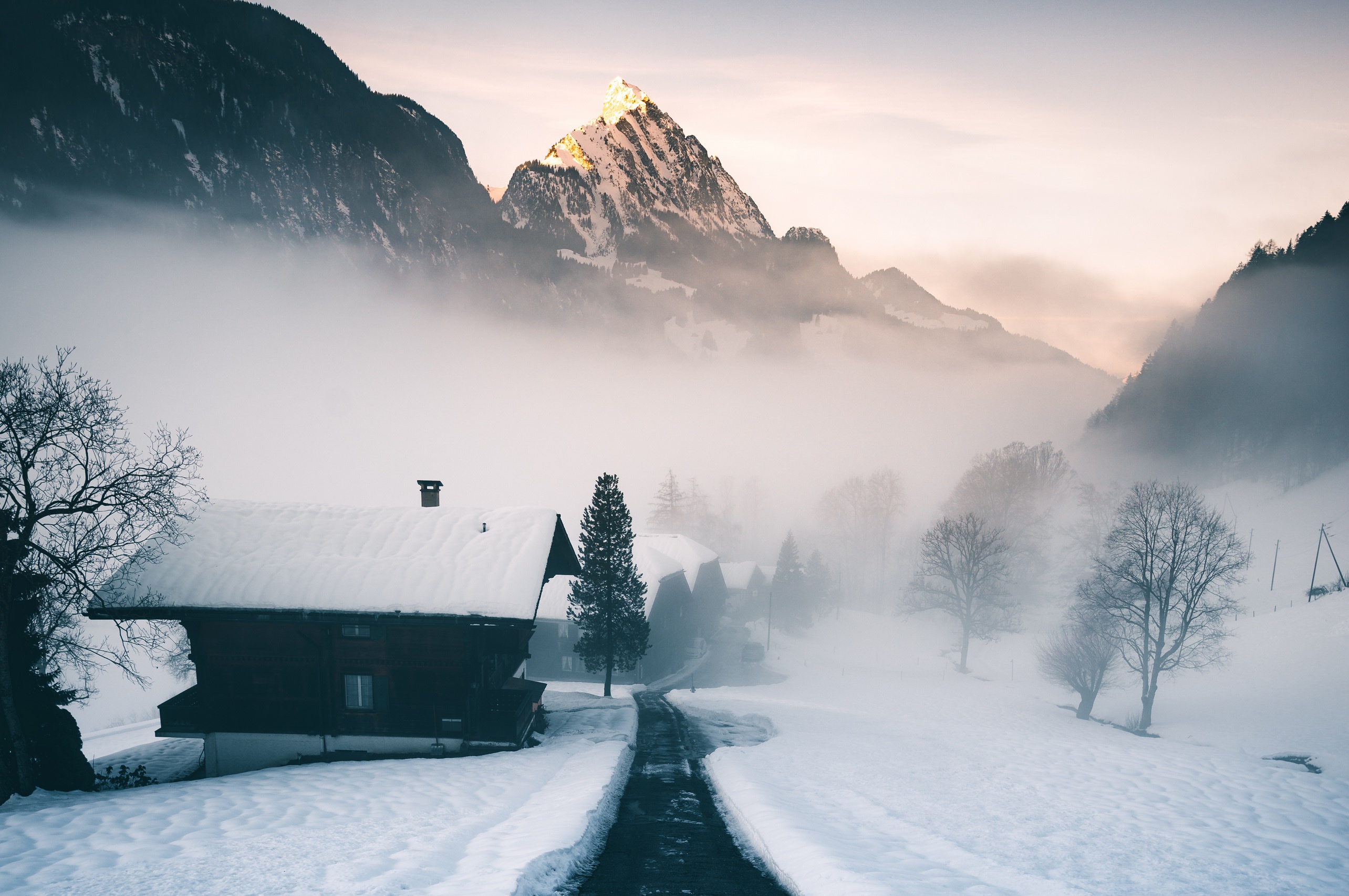 Snowy Swiss Alps with Mist and Chalet HD Wallpaper