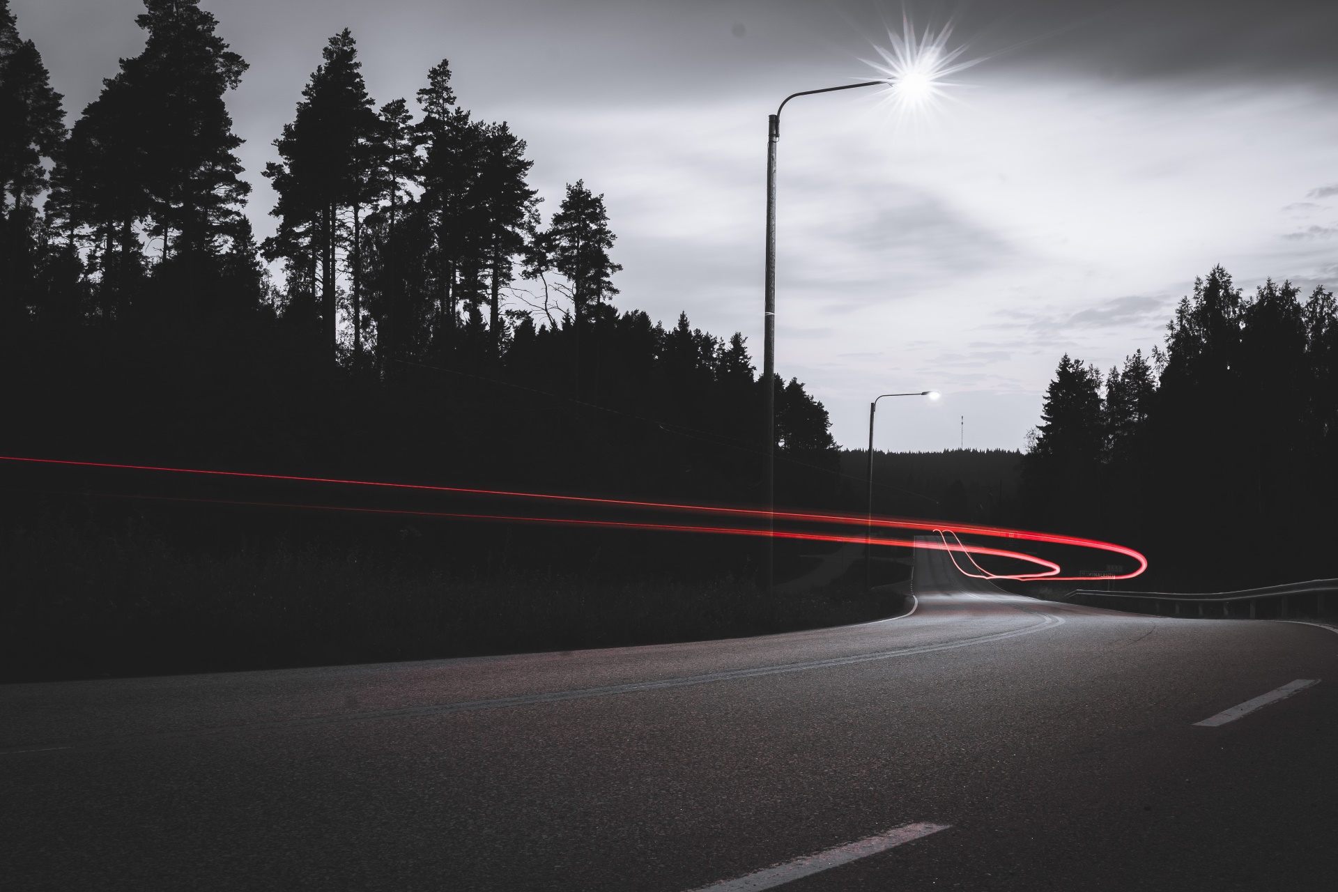 Long exposure of a road with light trails at night HD Wallpaper