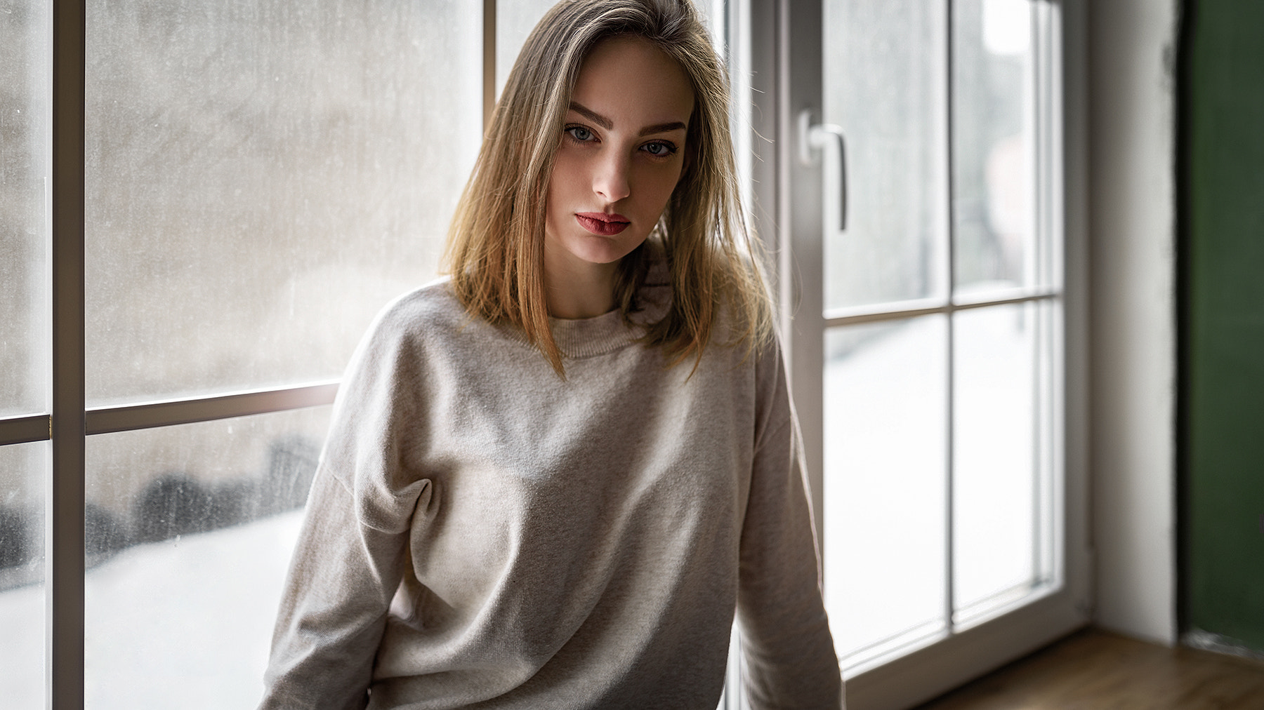 Woman with blonde hair and red lipstick by the window HD Wallpaper