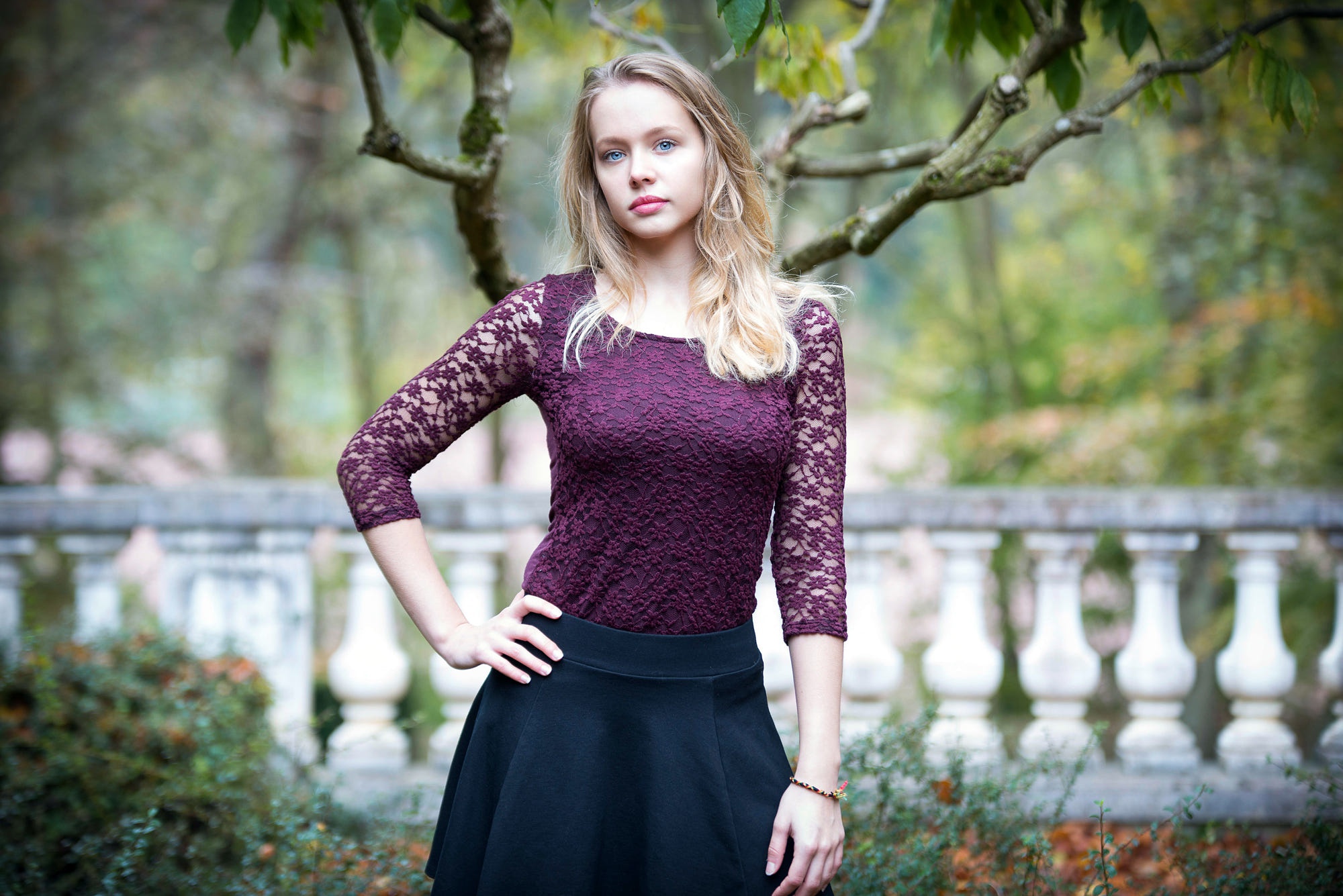 Young woman with blonde hair and blue eyes outdoors HD Wallpaper