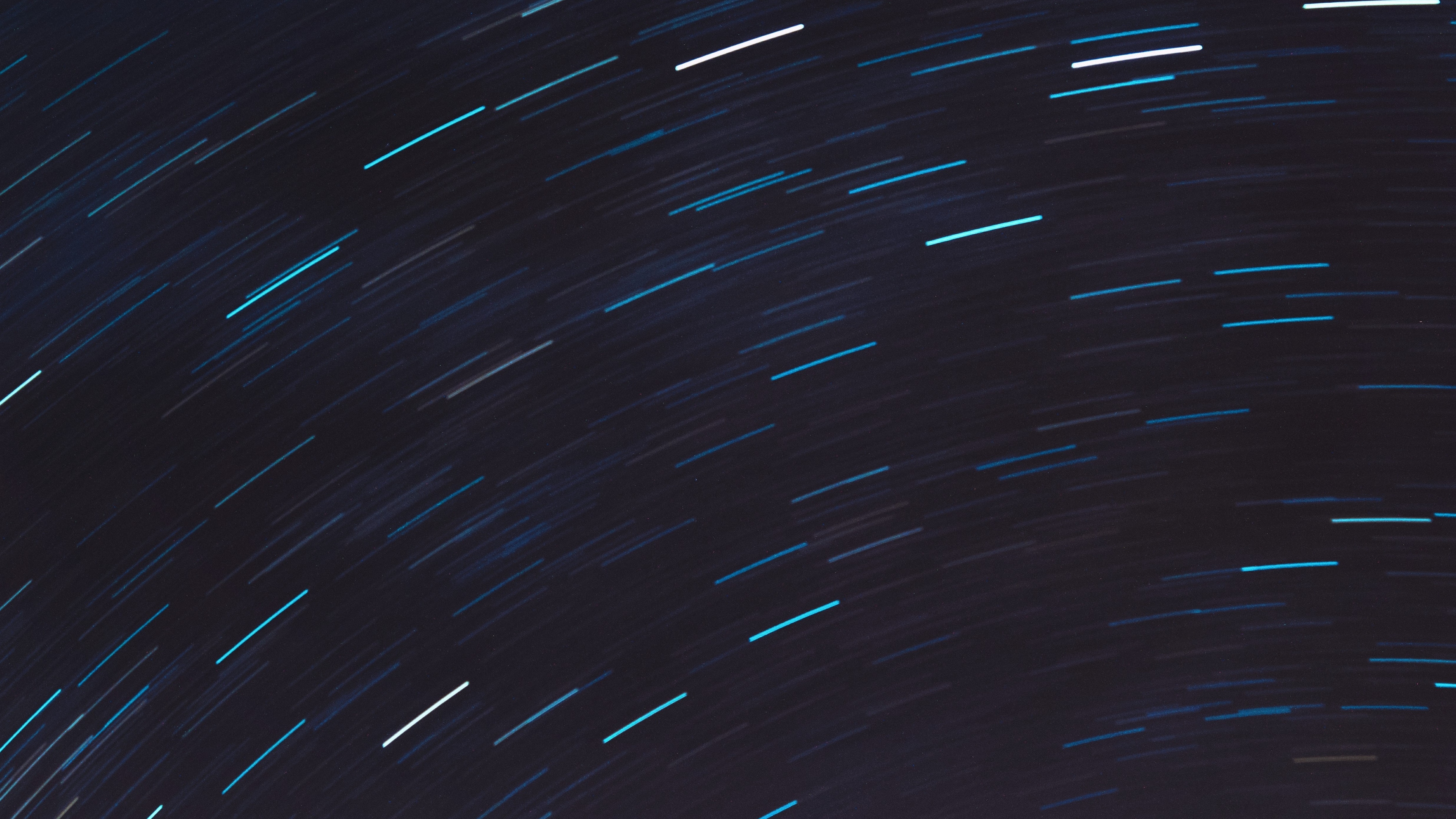 Star trails in the night sky HD Wallpaper