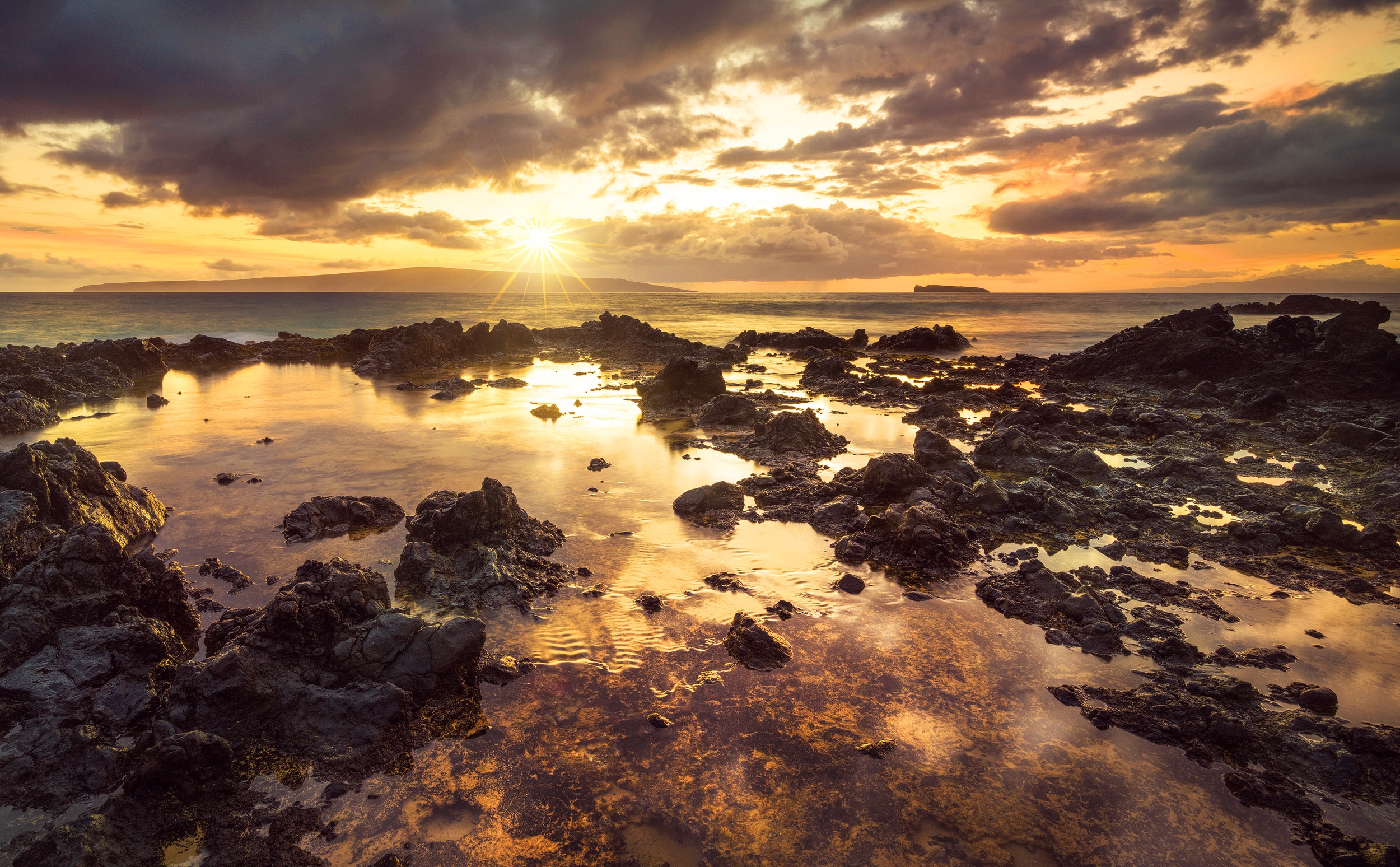 Rocky coastline at sunset with ocean and clouds HD Wallpaper