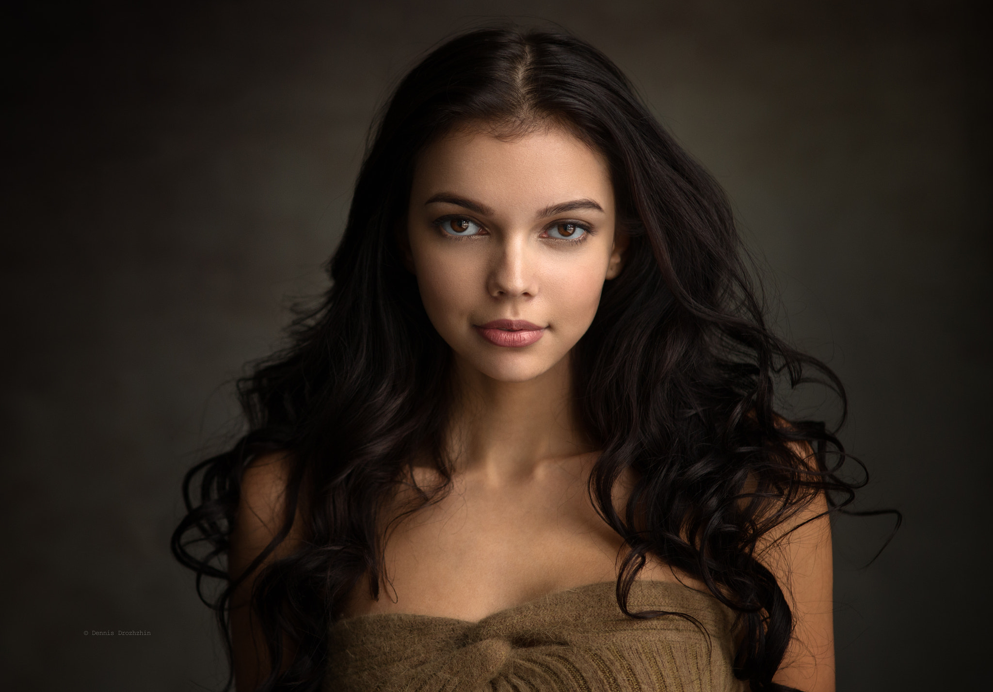 Portrait of a young woman with dark wavy hair HD Wallpaper