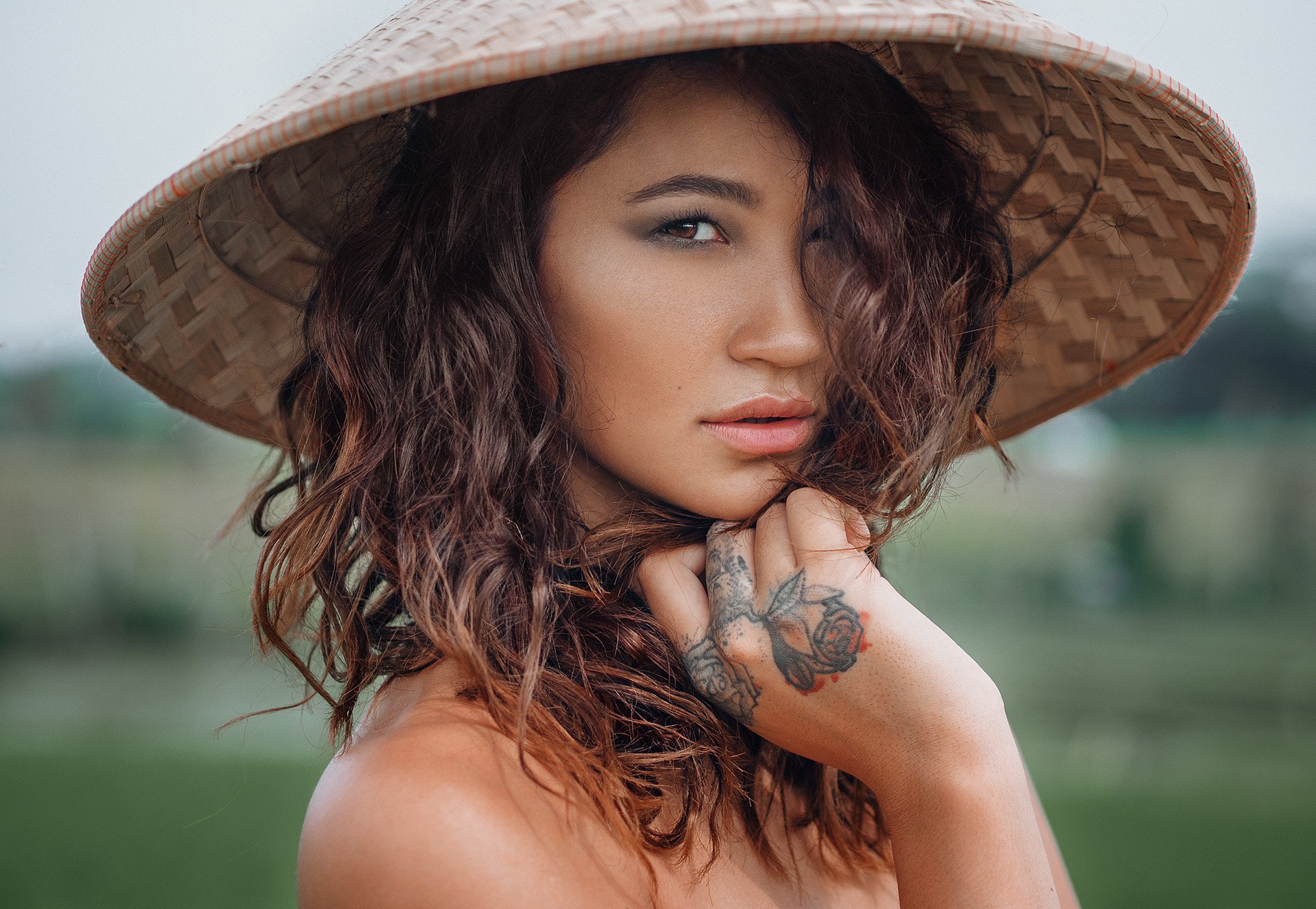 Woman wearing a conical hat HD Wallpaper