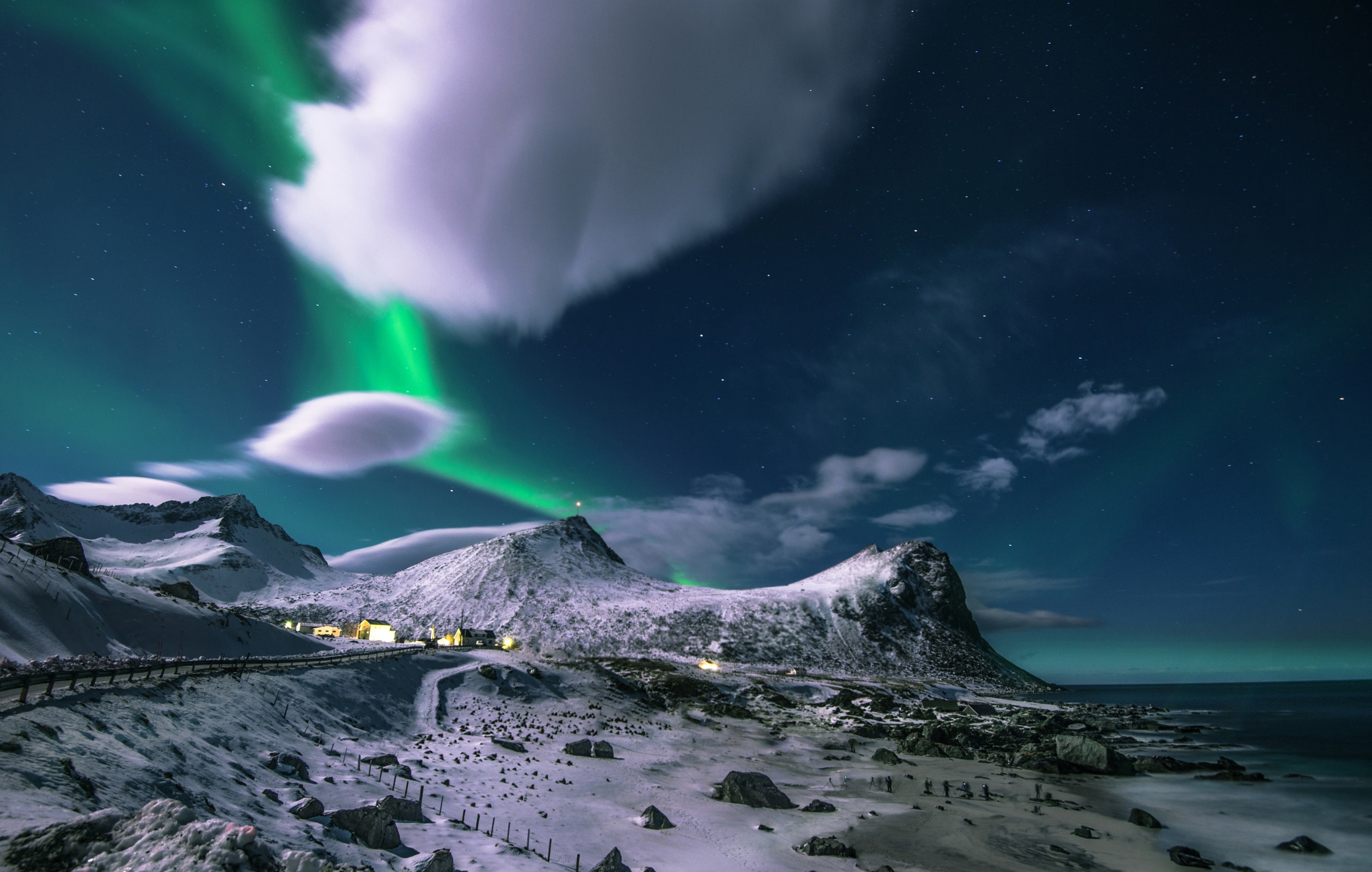 Aurora Borealis over snow-covered mountains and coast HD Wallpaper