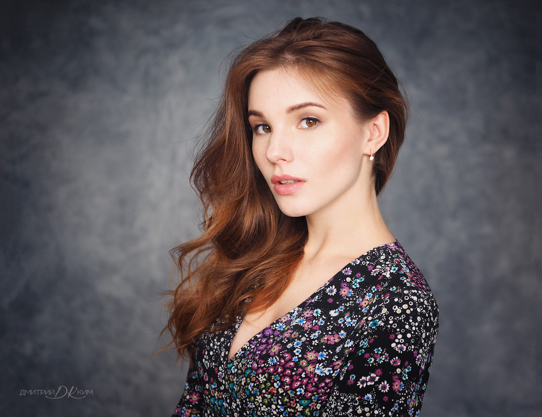 Woman with long brown hair in a floral dress HD Wallpaper