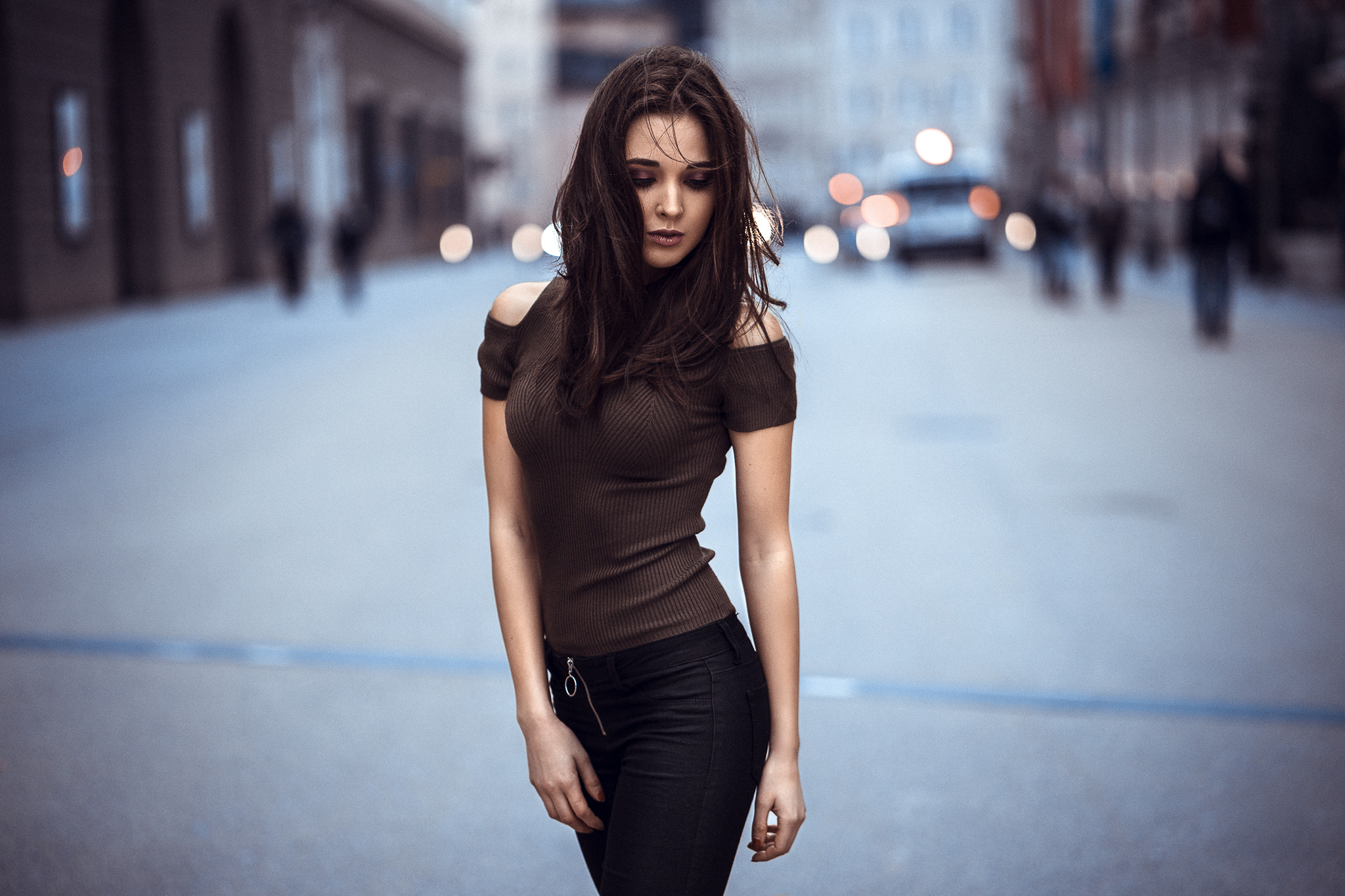 Woman in off-the-shoulder top and black pants on street HD Wallpaper