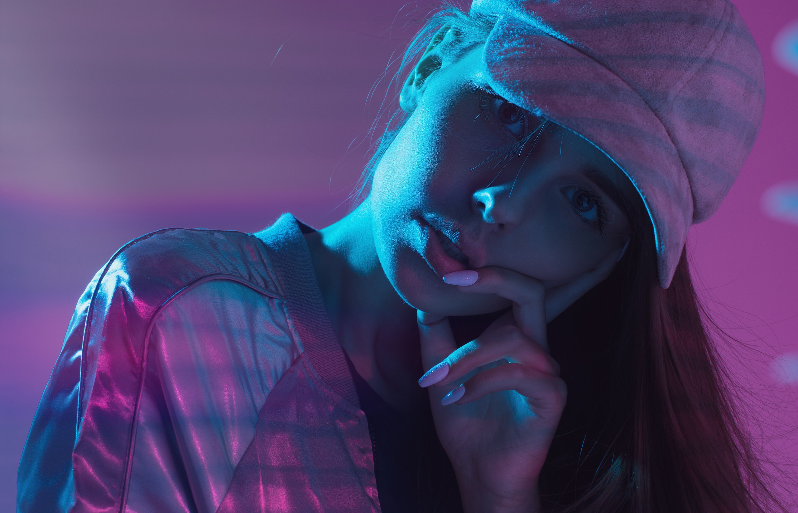 Woman wearing a baseball cap and jacket with purple and blue lighting HD Wallpaper