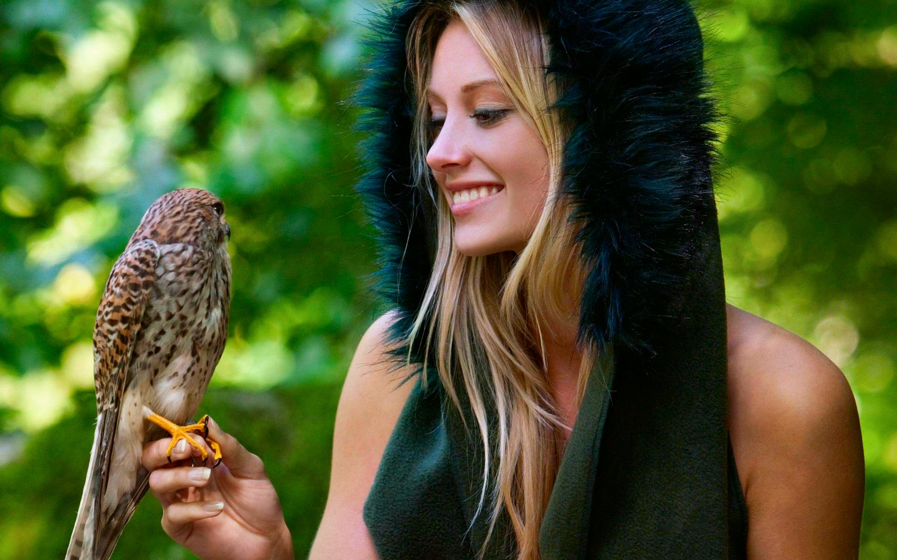 Woman with a bird in a forest HD Wallpaper