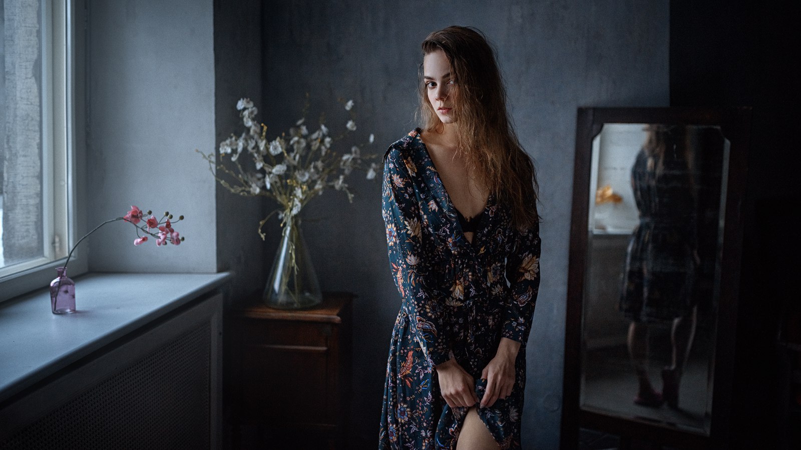 Woman in floral dress by window HD Wallpaper