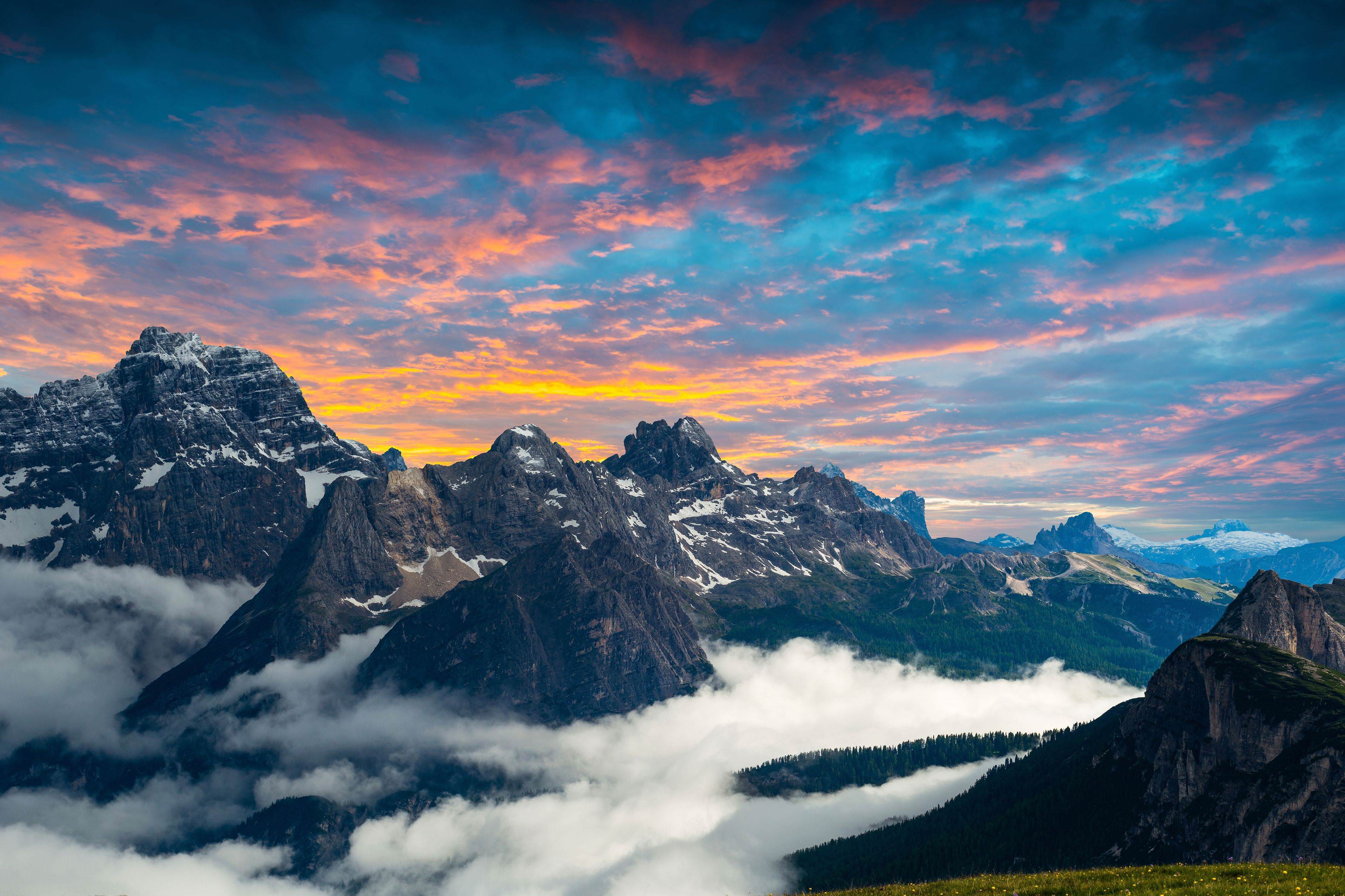 Mountain range with clouds at sunset HD Wallpaper