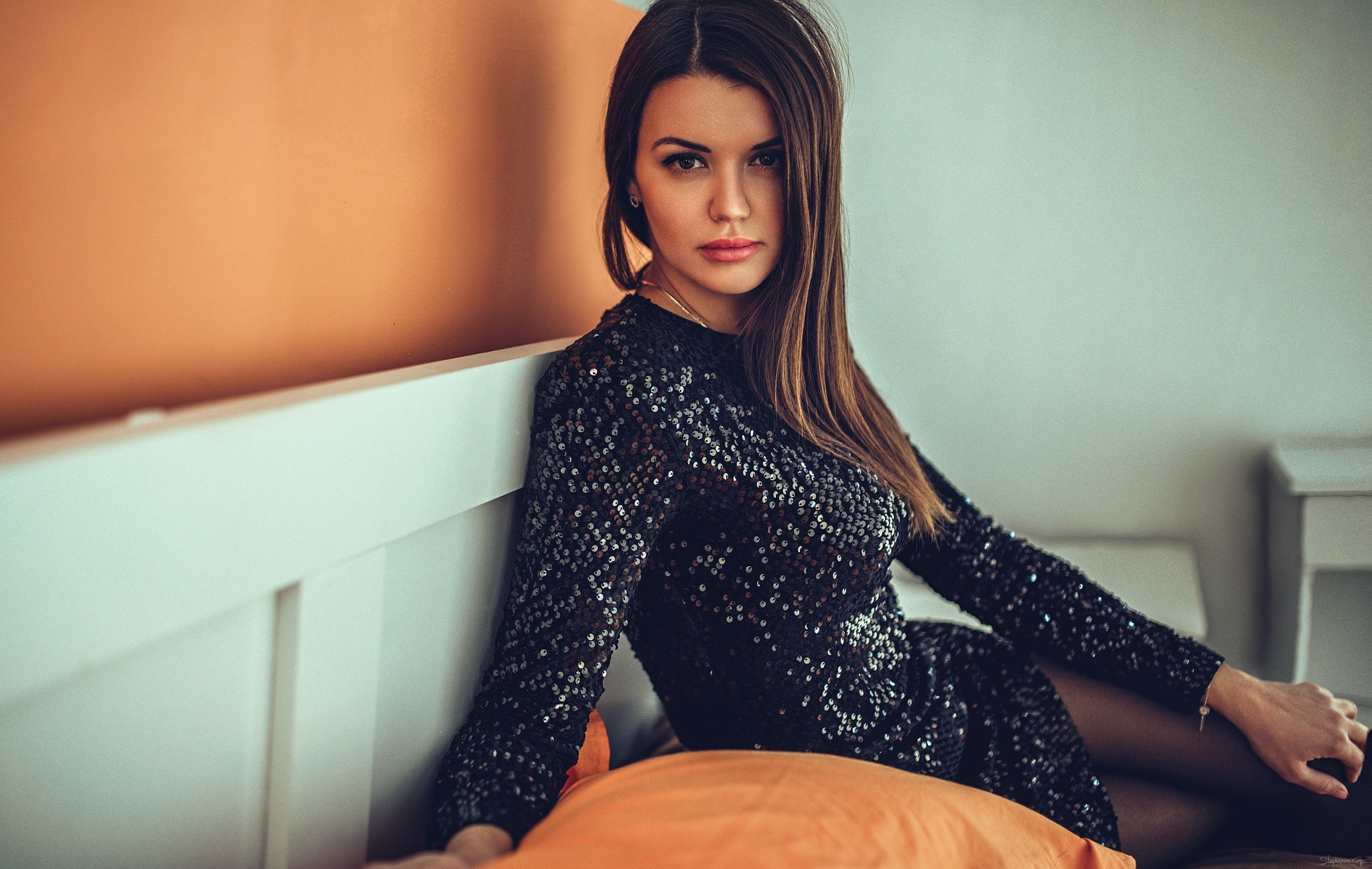 Woman in black sequined dress sitting on a bed HD Wallpaper