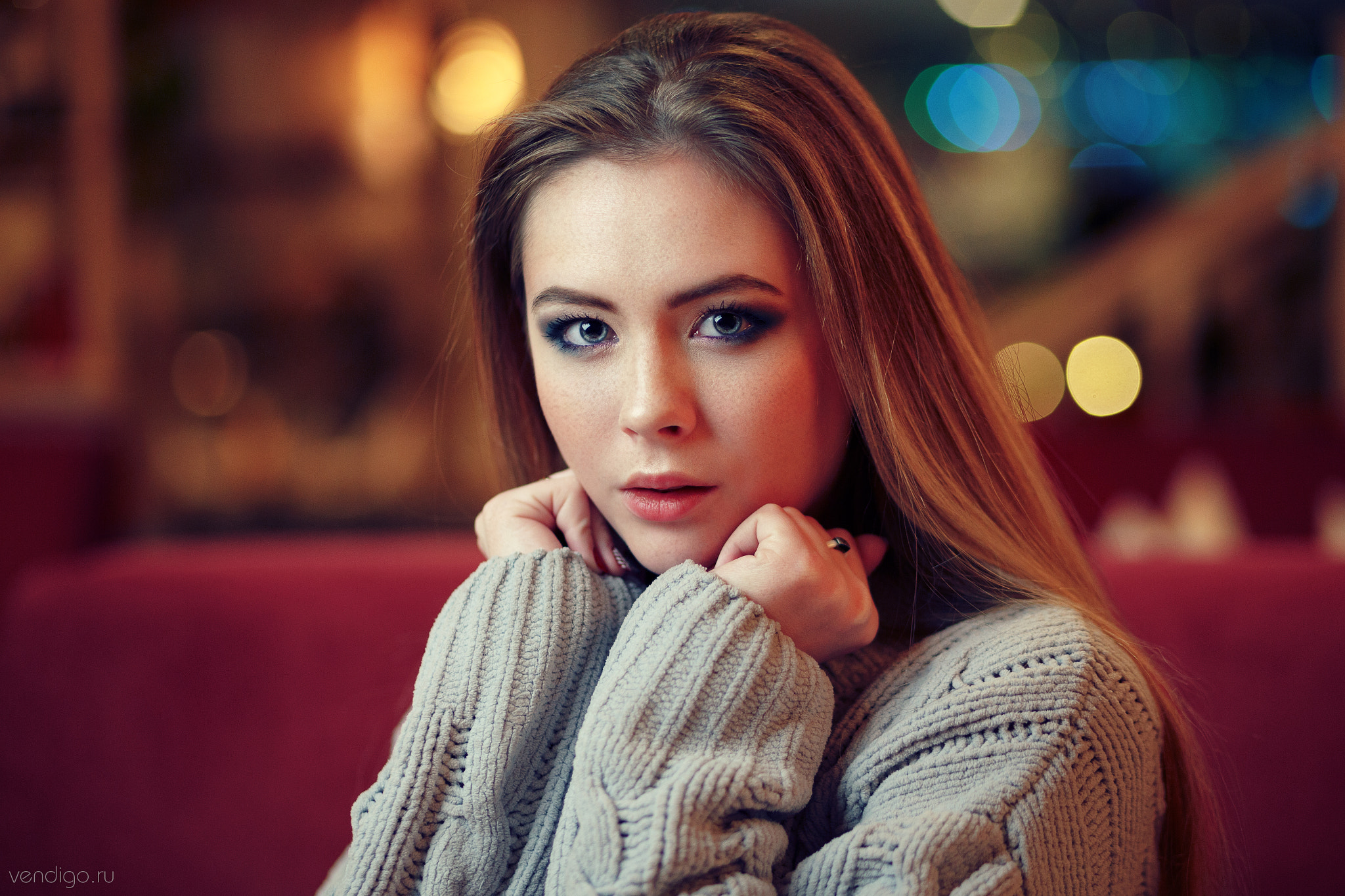 Woman with blue eyes wearing a sweater HD Wallpaper