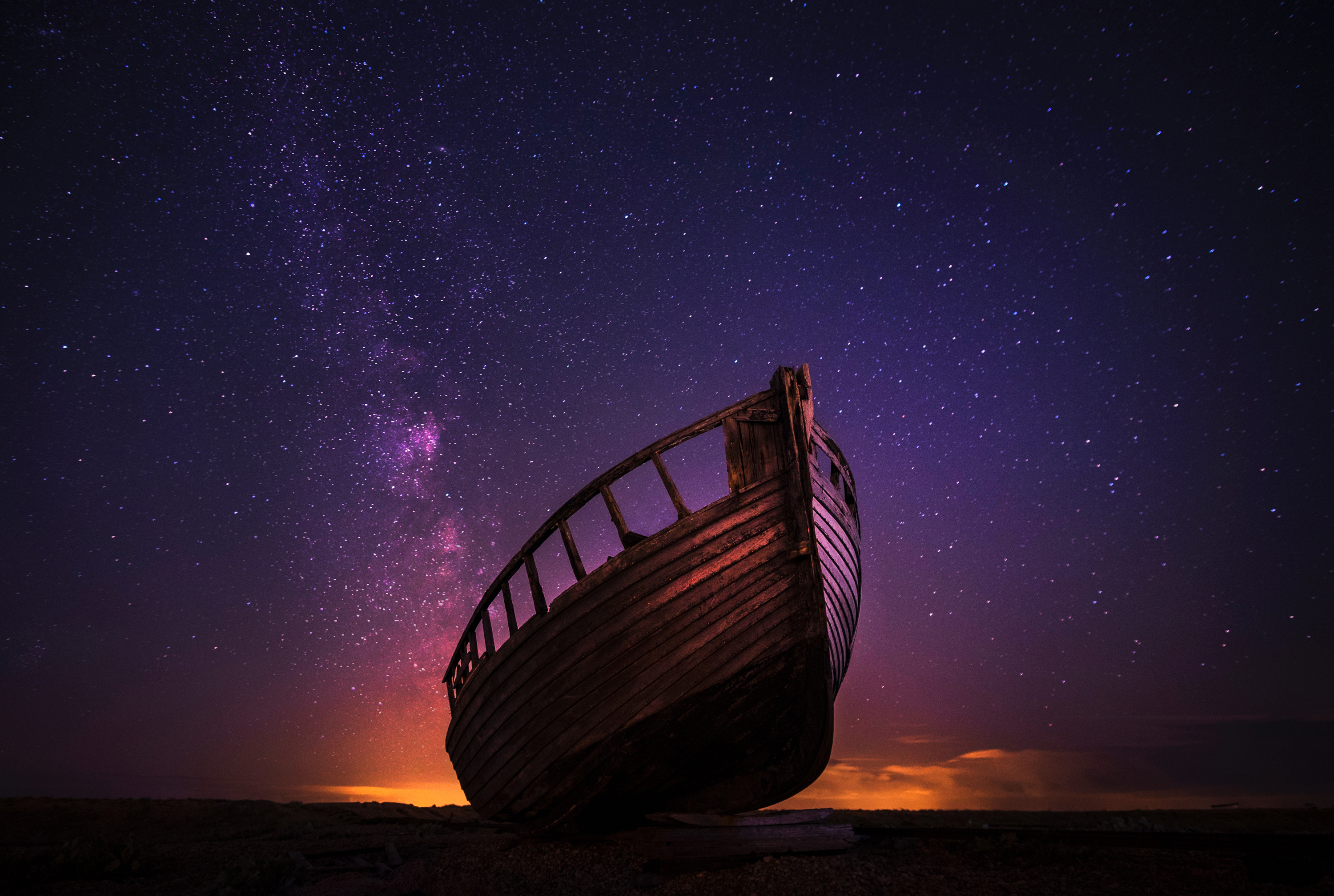 Abandoned boat under a starry sky HD Wallpaper