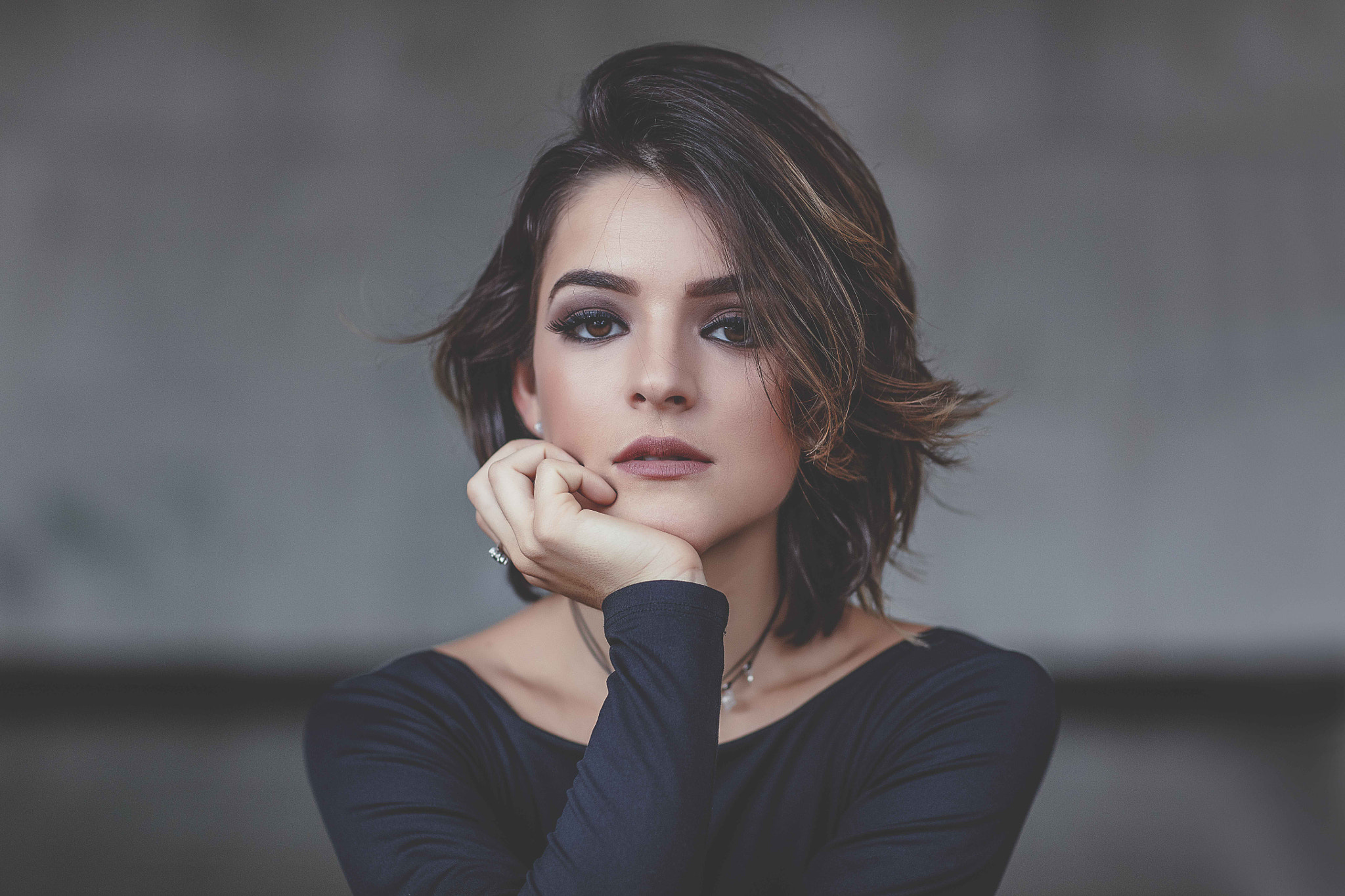 Portrait of a young woman with brown hair and eyes HD Wallpaper