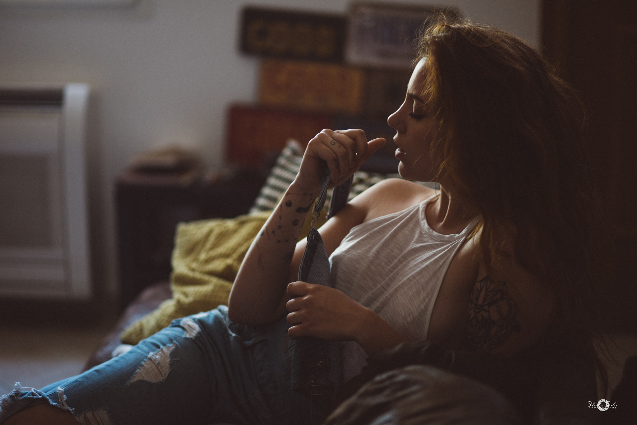 Woman in white top and ripped jeans with tattoos HD Wallpaper