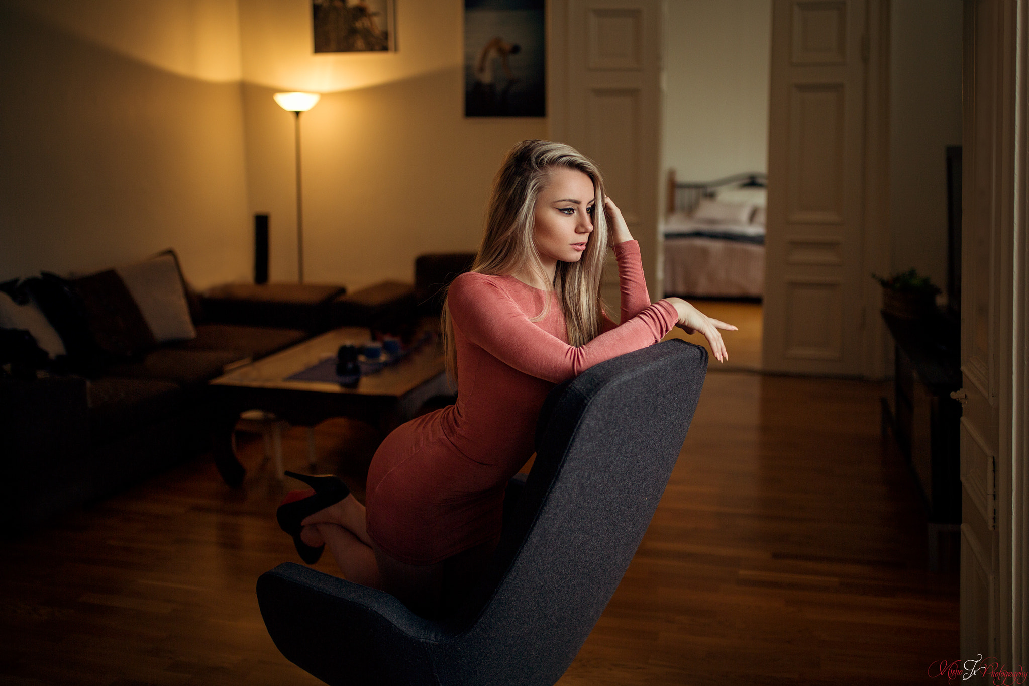 Woman in dress kneeling on chair HD Wallpaper