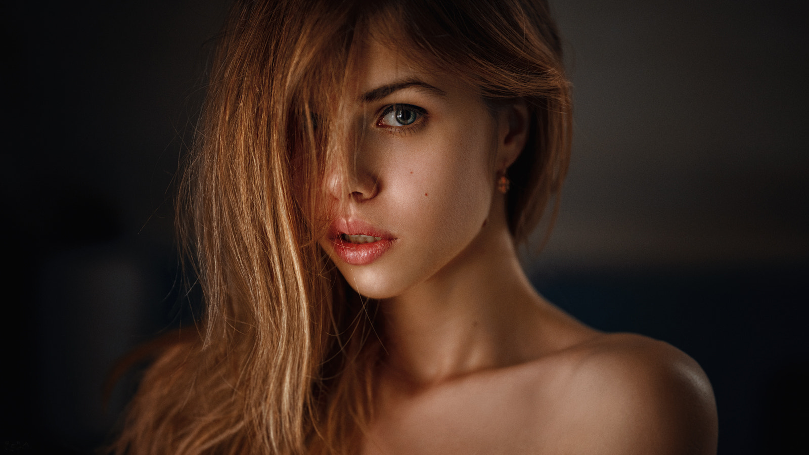 Portrait of a young woman with hair covering her face HD Wallpaper
